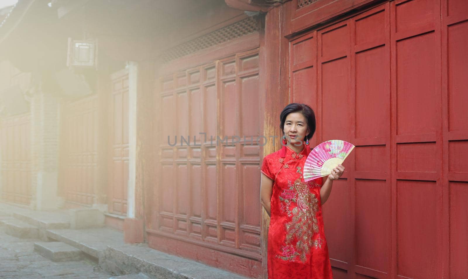 Female Tourist with Chinese Traditional Clothing in Lijiang Old town ,Yunnan, China.