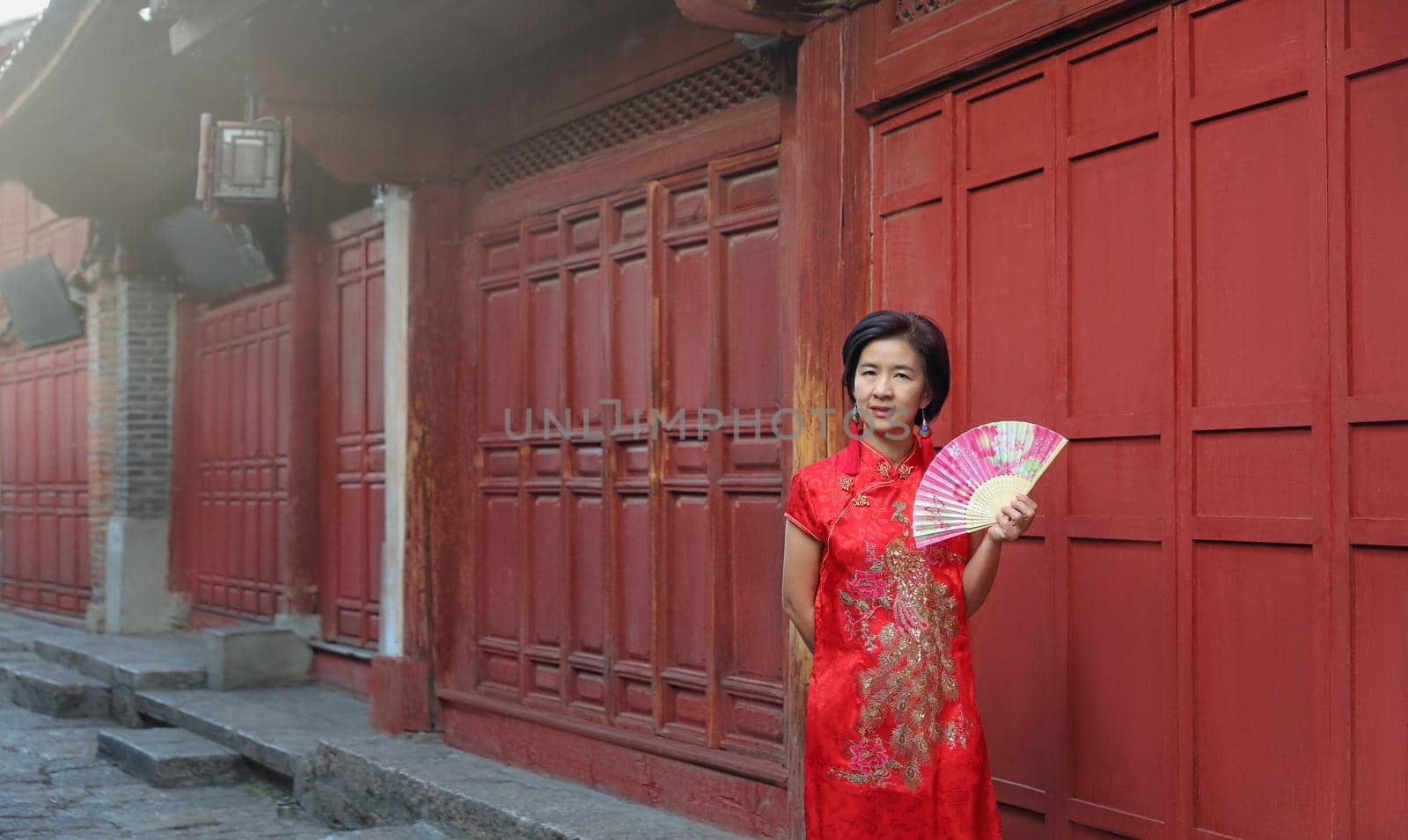 Female Tourist with Chinese Traditional Clothing in Lijiang Old town ,Yunnan, China. by toa55