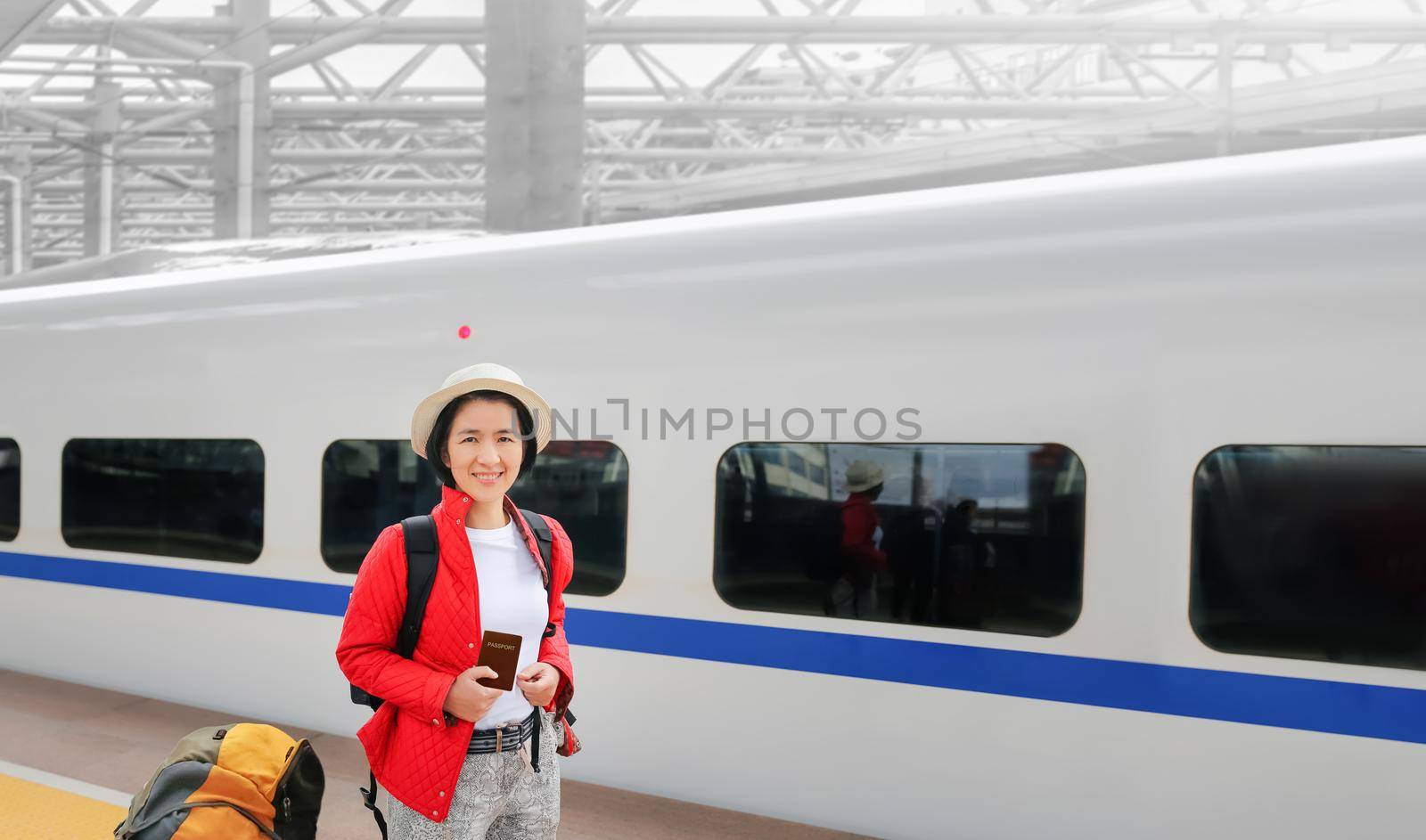 ‎Solo travelling , middle aged asian female tourist travel with high-speed train by toa55