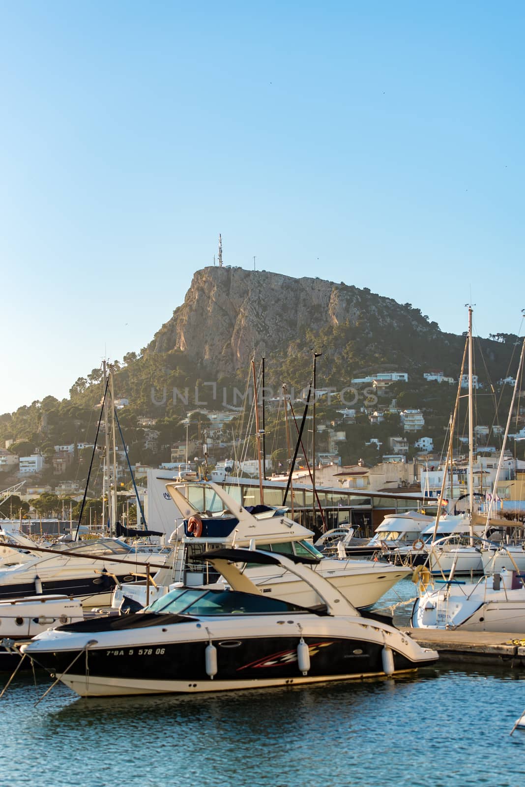 L ESTARTIT, GIRONA, SPAIN : 2020 FEBRERO 06 : Sunny day in  Panoramic view of Estartit seaport. by martinscphoto