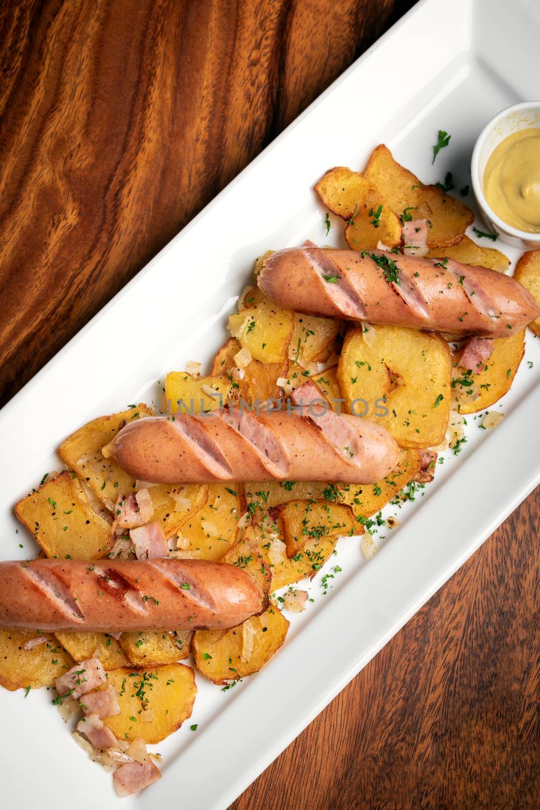 german cheese sausages with fried potato and mustard by jackmalipan