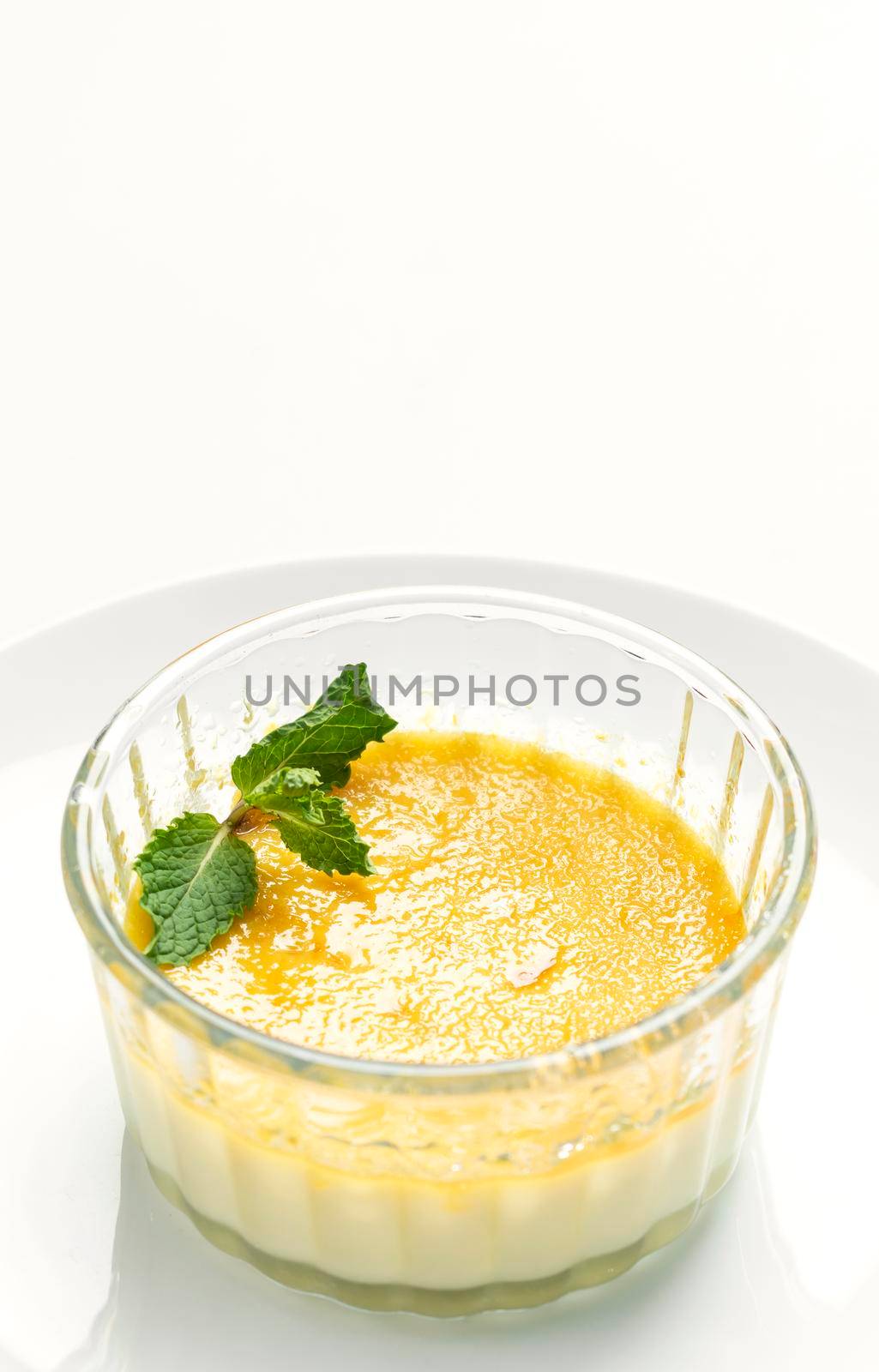 vegan dairy free organic coconut creme brulee on white background by jackmalipan