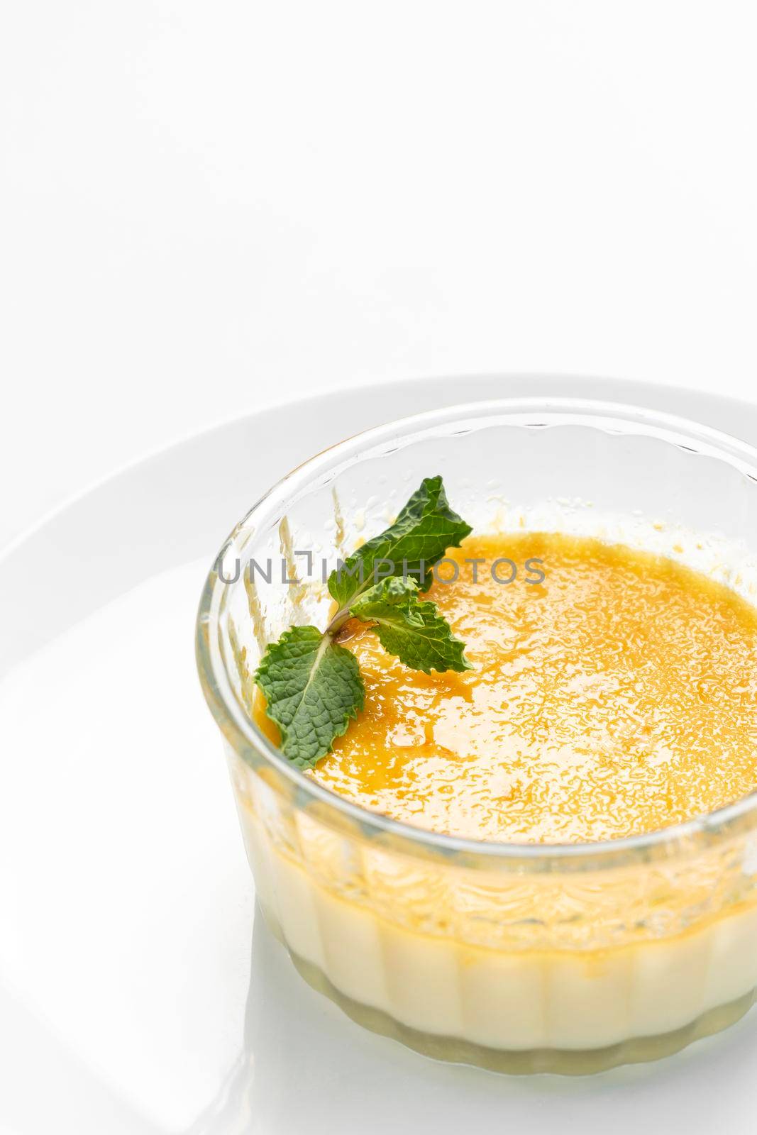 vegan dairy free organic coconut creme brulee on white background by jackmalipan