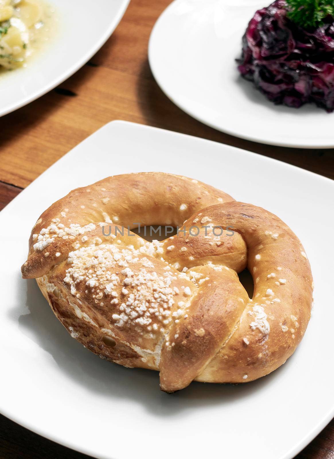 vegan dairy-free organic german traditional pretzel bread on wood table