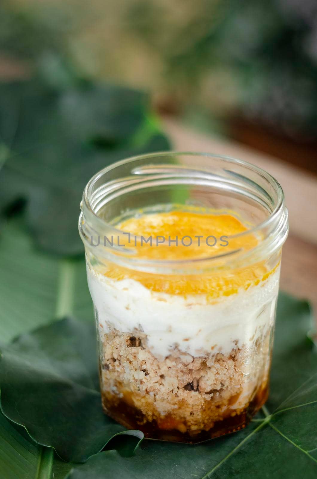 granola, coconut mousse, dates and turmeric powder healthy vegan dessert by jackmalipan