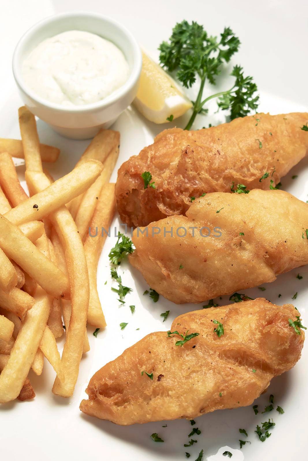 british traditional fish and chips meal on wood table