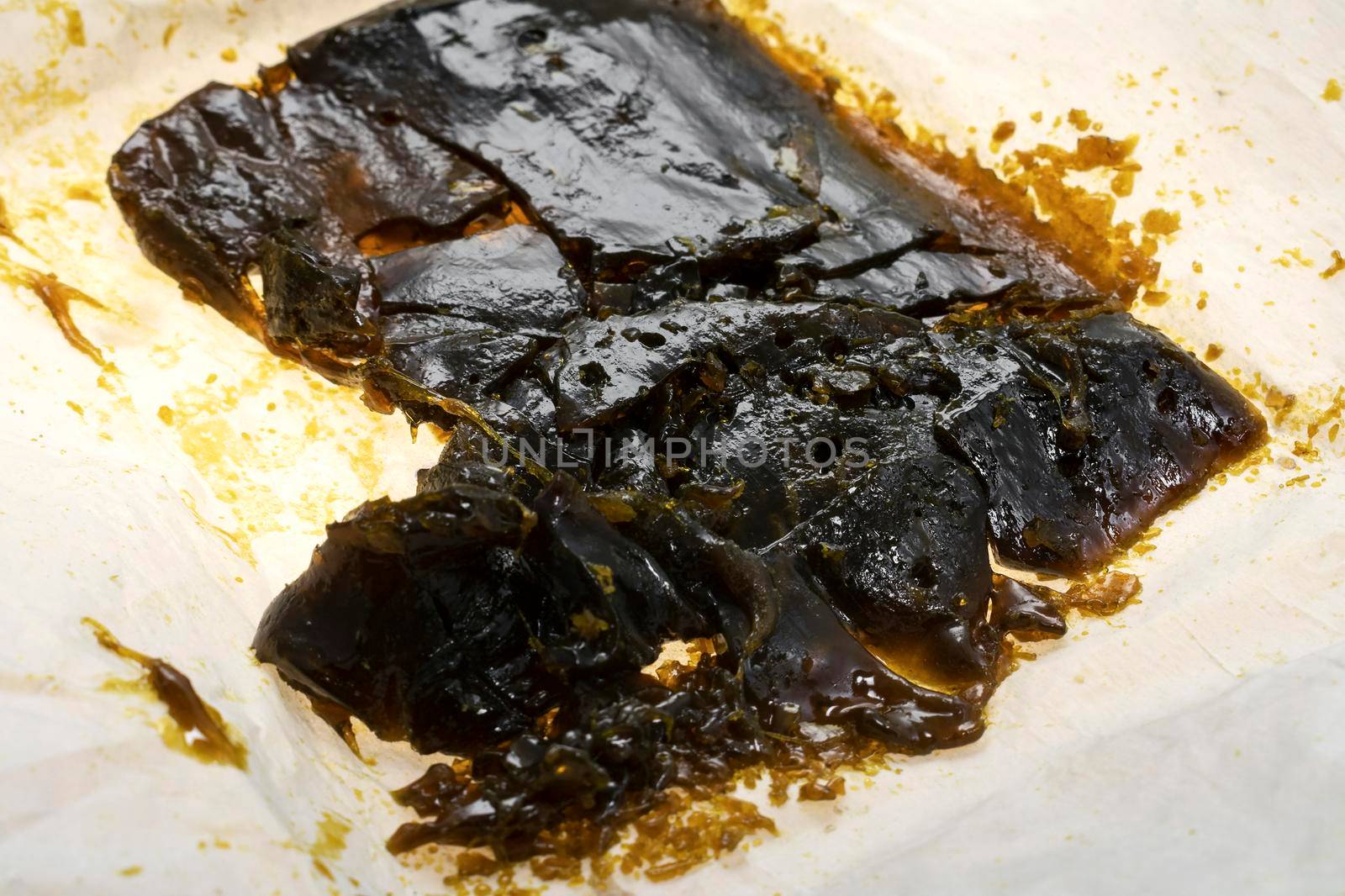 medical marijuana shatter wax processed cannabis concentrate closeup in california by jackmalipan