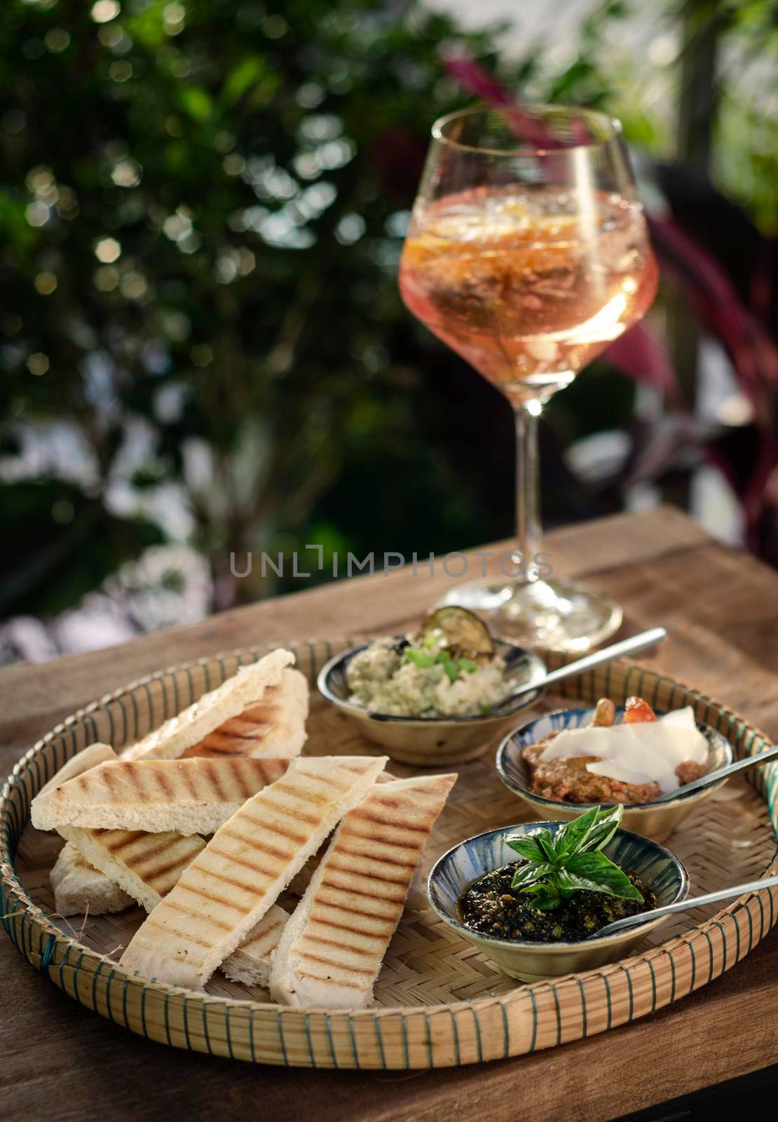 vegetarian turkish mezze snack tapas platter on rustic wood restaurant table