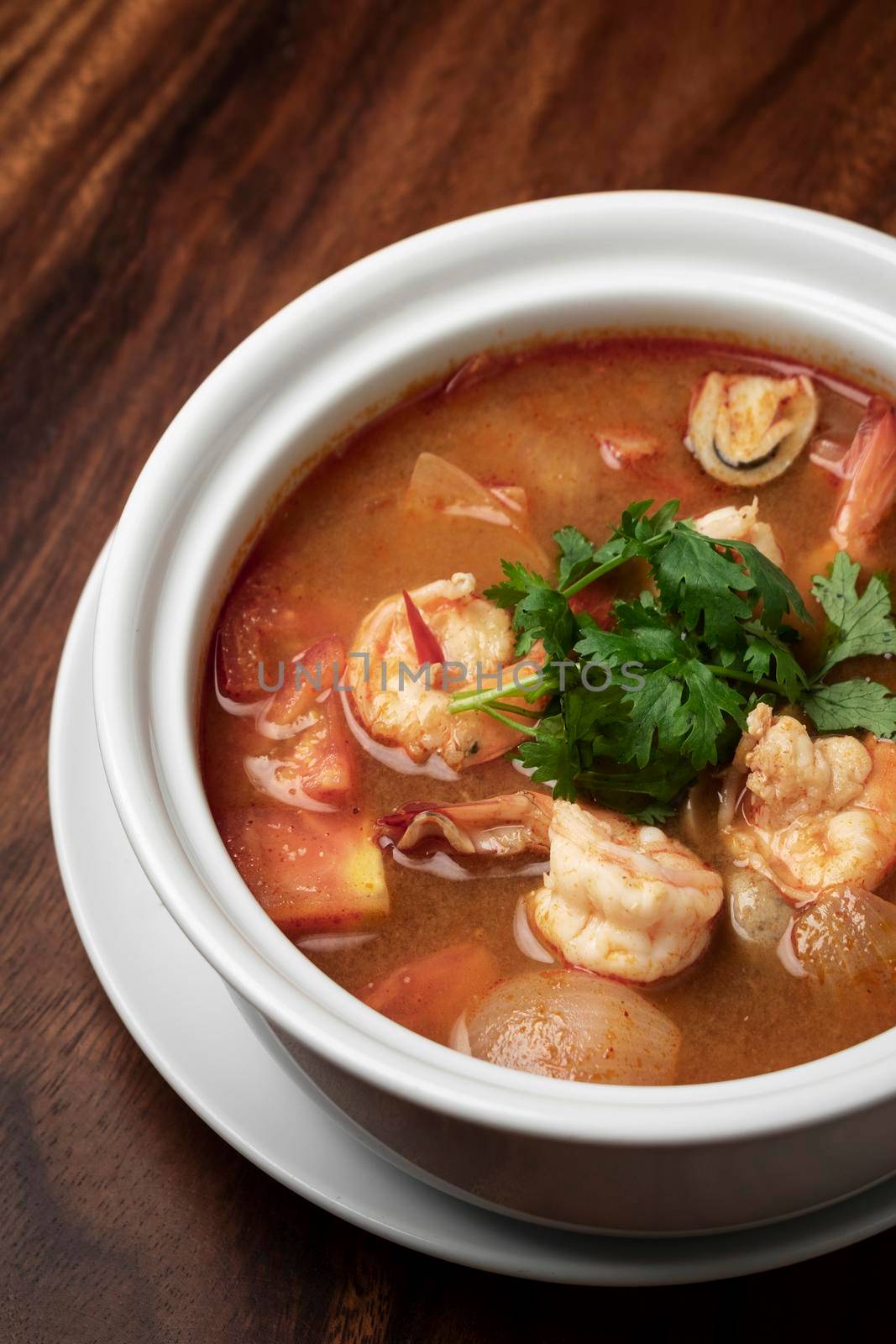 thai tom yum kung spicy and sour shrimp soup on white table background in phuket thailand
