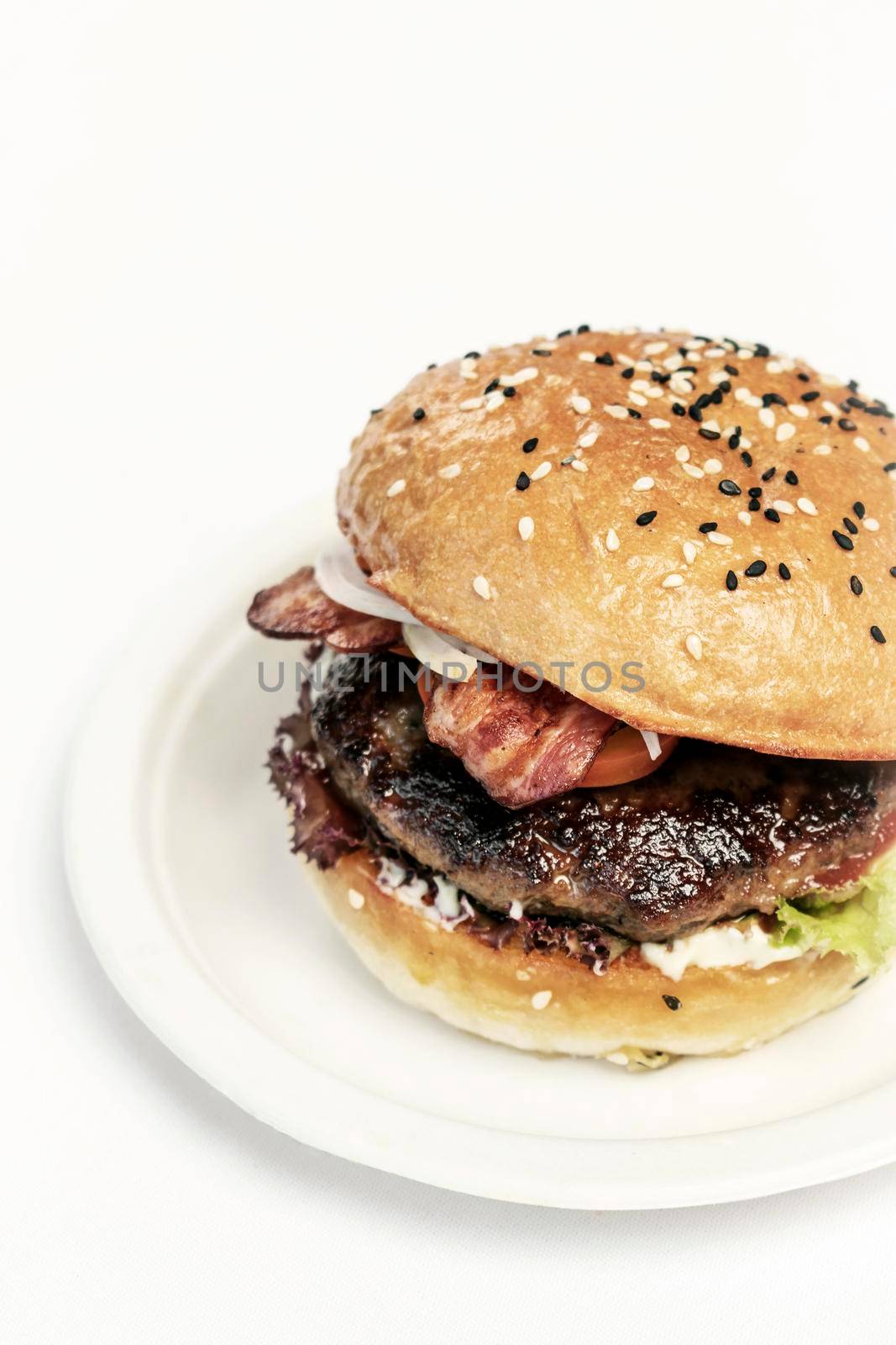 australian organic beef burger with bacon on white table