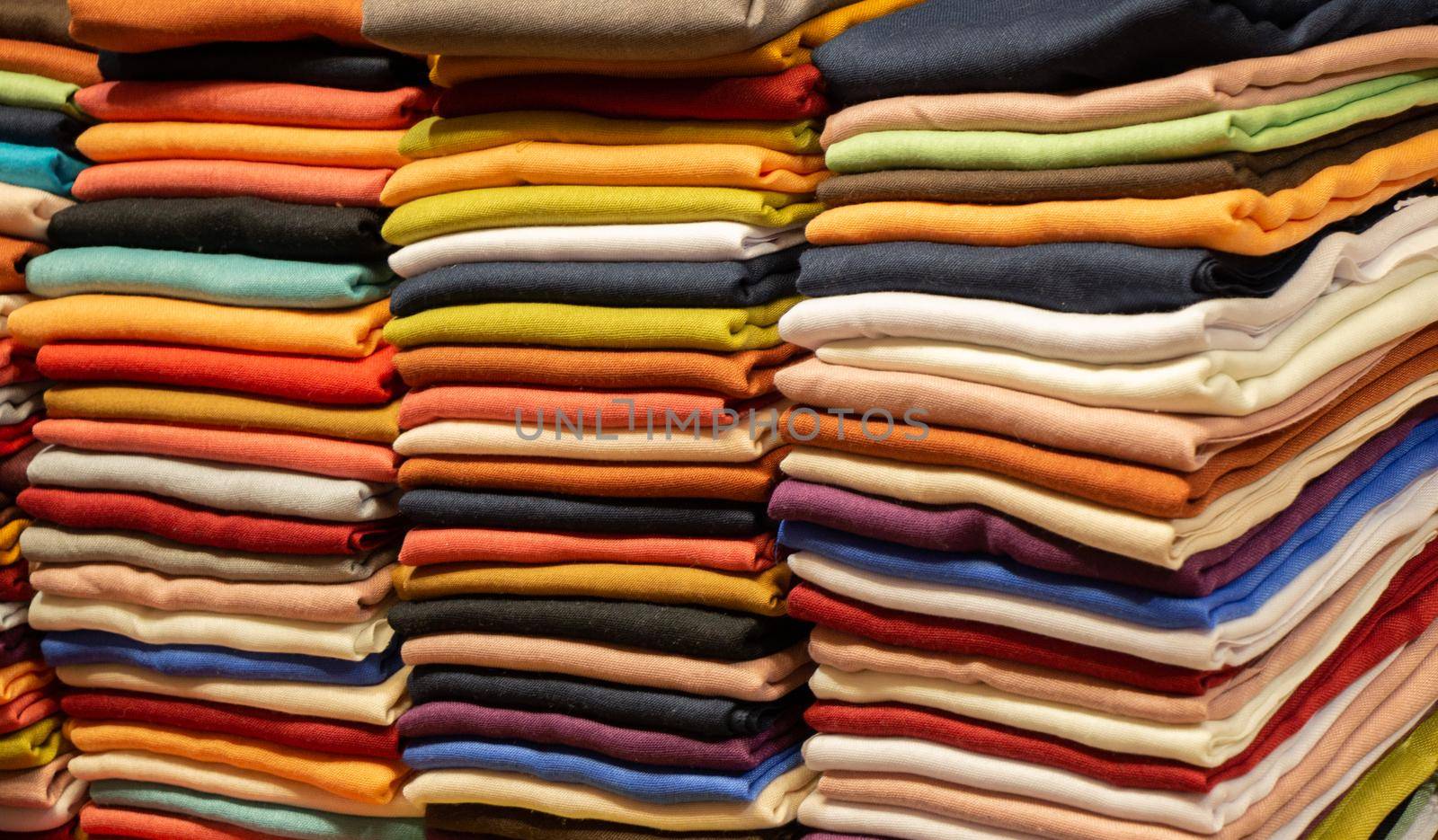 Pile of bright Multi-colored pieces of fabric in a bazaar