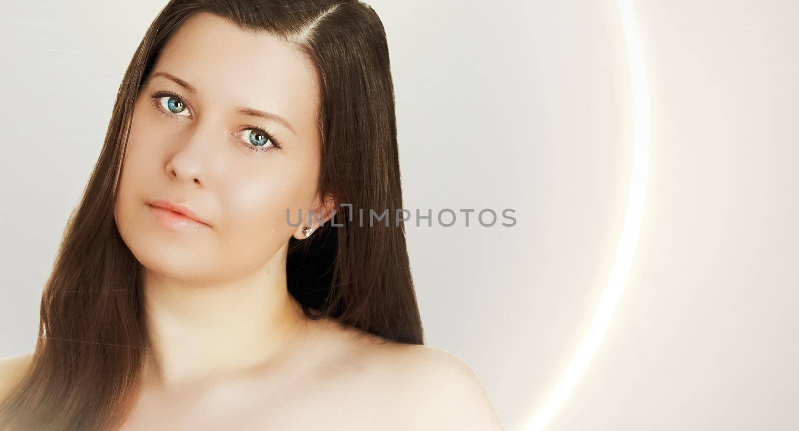 Suntan skin tone and beauty routine. Beautiful brunette female model with natural tan, face portrait of young woman by Anneleven