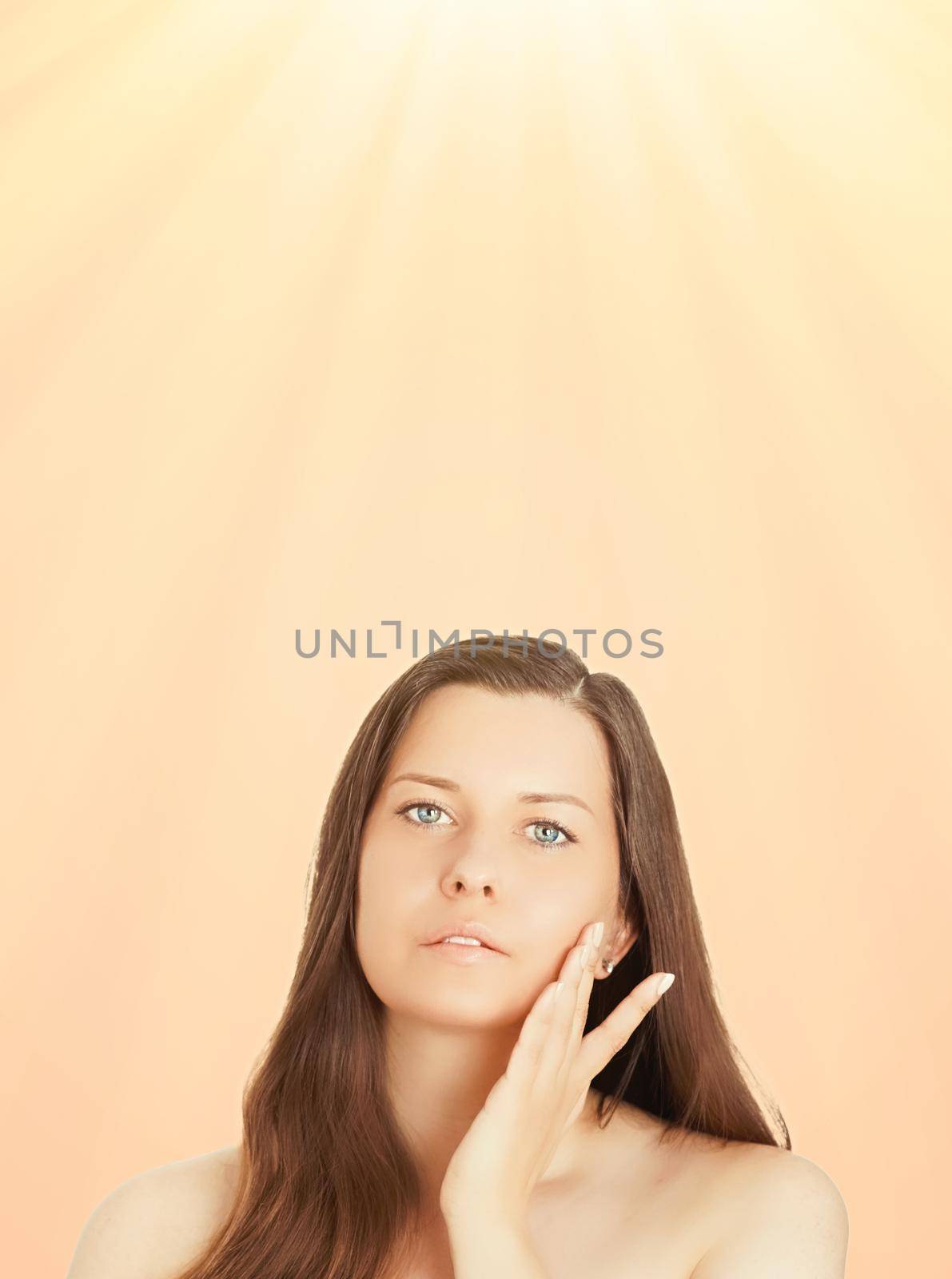 Sunny face portrait of young woman, suntan skin tone and beauty cosmetics. Beautiful brunette female model with natural tan using sunscreen product by Anneleven