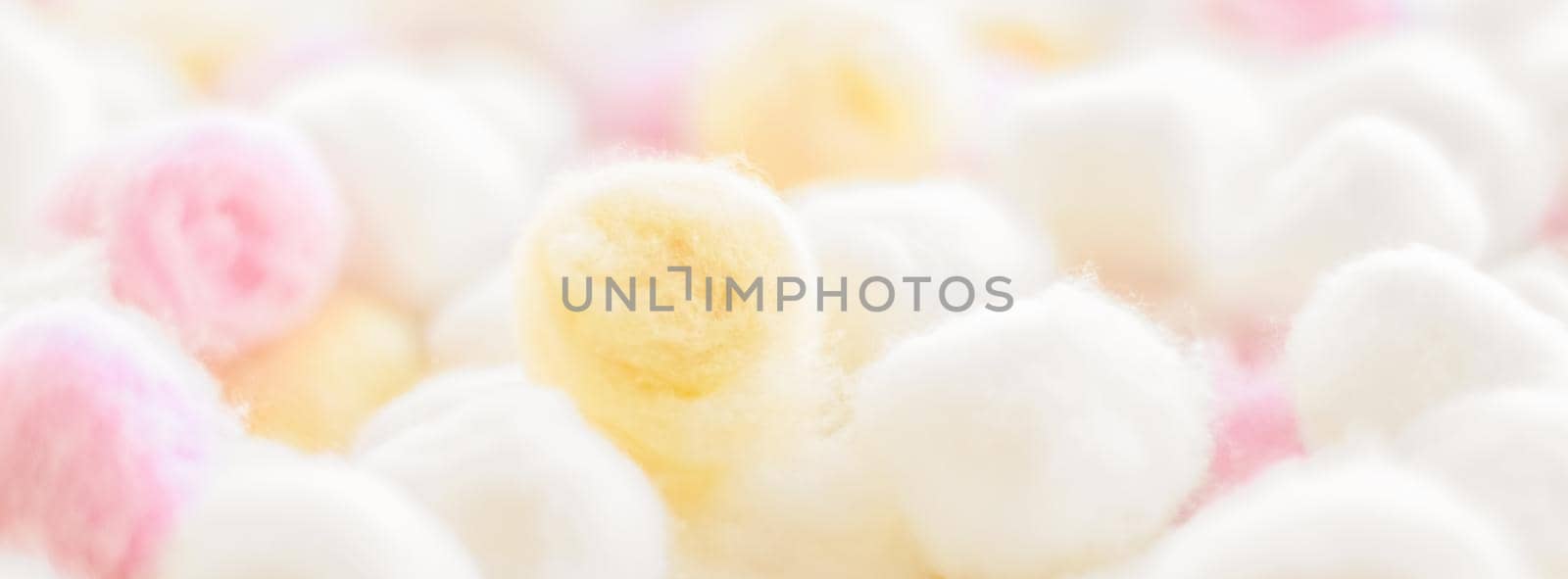 Cosmetology, branding and cleanliness concept - Organic cotton balls background for morning routine, spa cosmetics, hygiene and natural skincare beauty brand product as healthcare and medical design