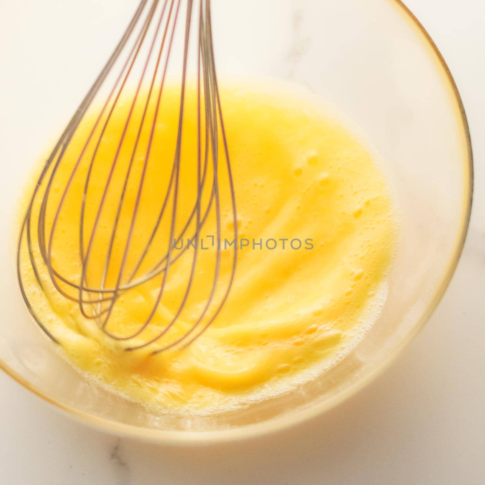 Making of mixing eggs in bowl on marble table as homemade food flat lay, top view food brand photography flatlay and recipe for cooking blog, menu or cookbook design by Anneleven