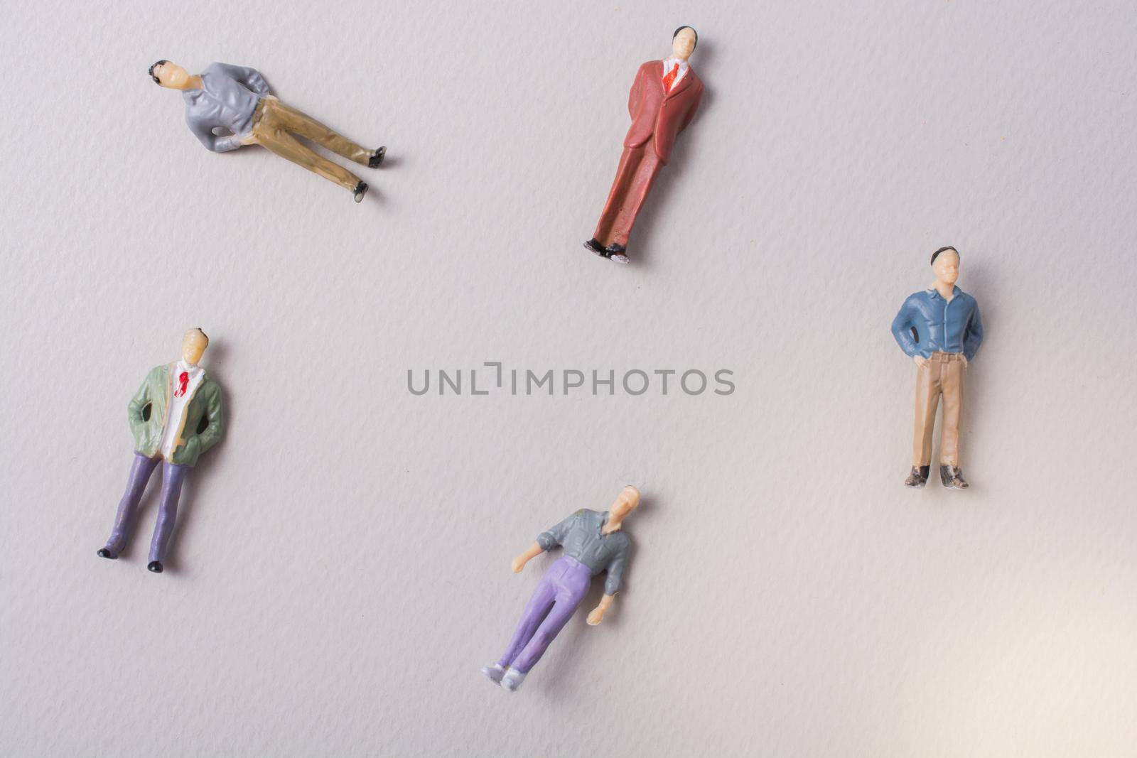 Tiny figurine of men miniature model in view