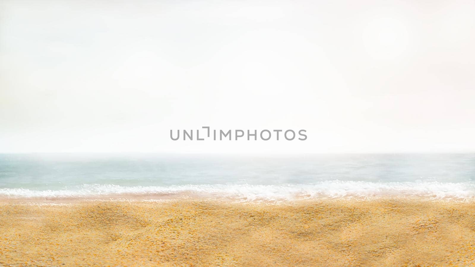 Blurring the background of a sandy beach in the vicinity of the sea