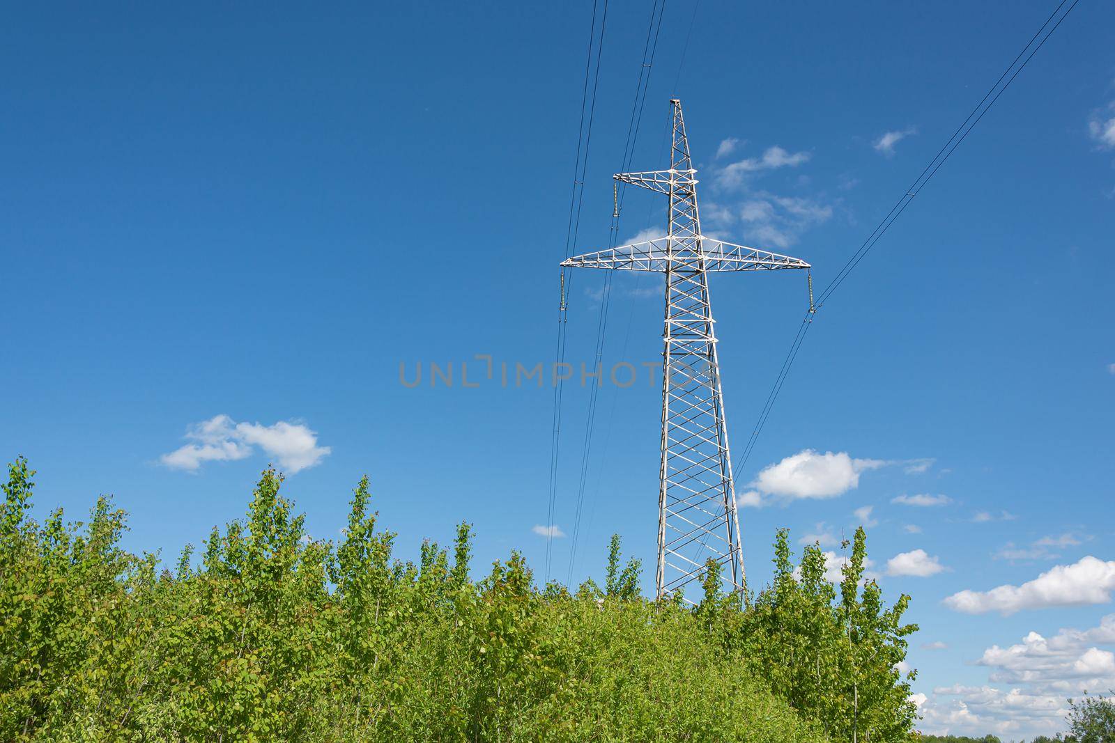 Industry. Support mast and high-voltage power line. Stock photo.