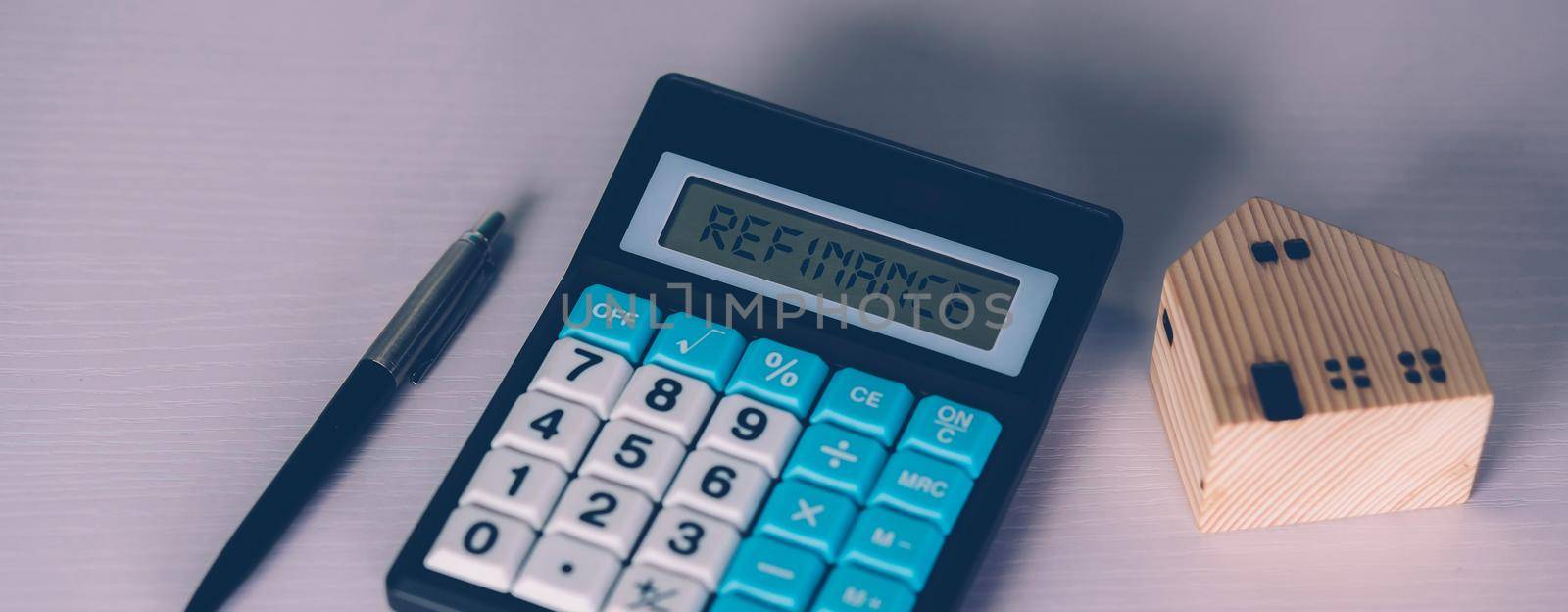 Calculator with text refinance home while expense for loan mortgage, investment and banking, property and cost, real estate and transfer for debt, planning and management of finance, business concept.