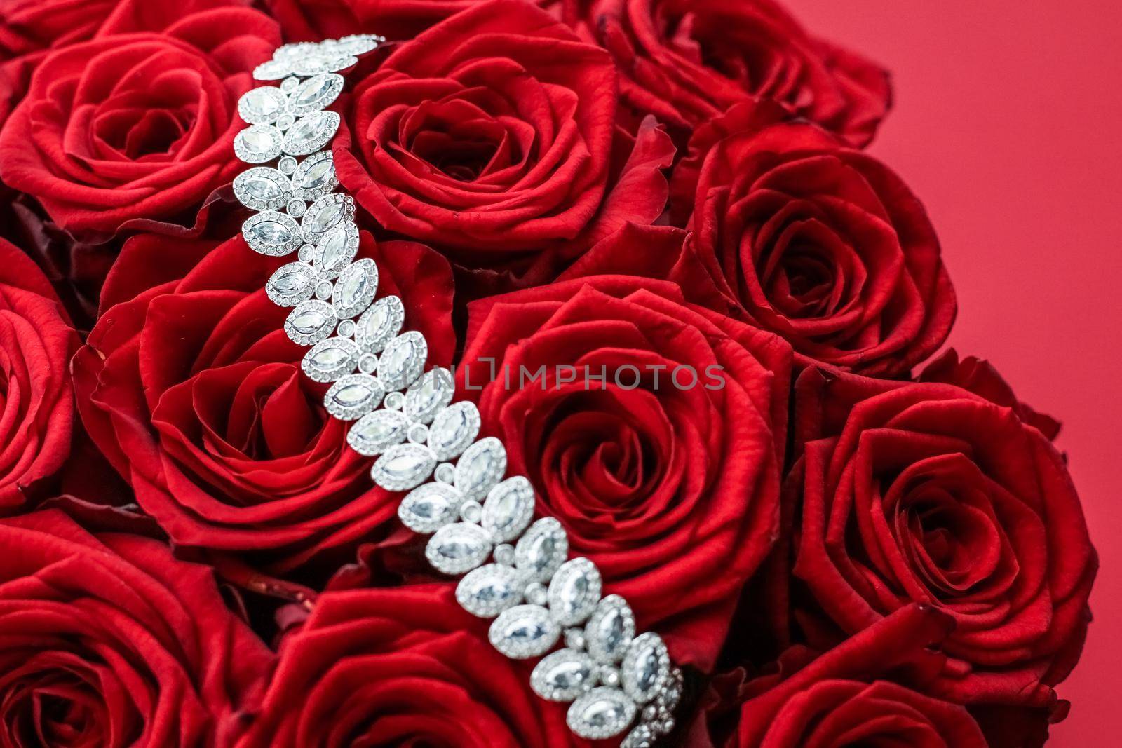 Gemstone jewellery, wedding fashion and luxe shopping concept - Luxury diamond bracelet and bouquet of red roses, jewelry love gift on Valentines Day and romantic holidays present