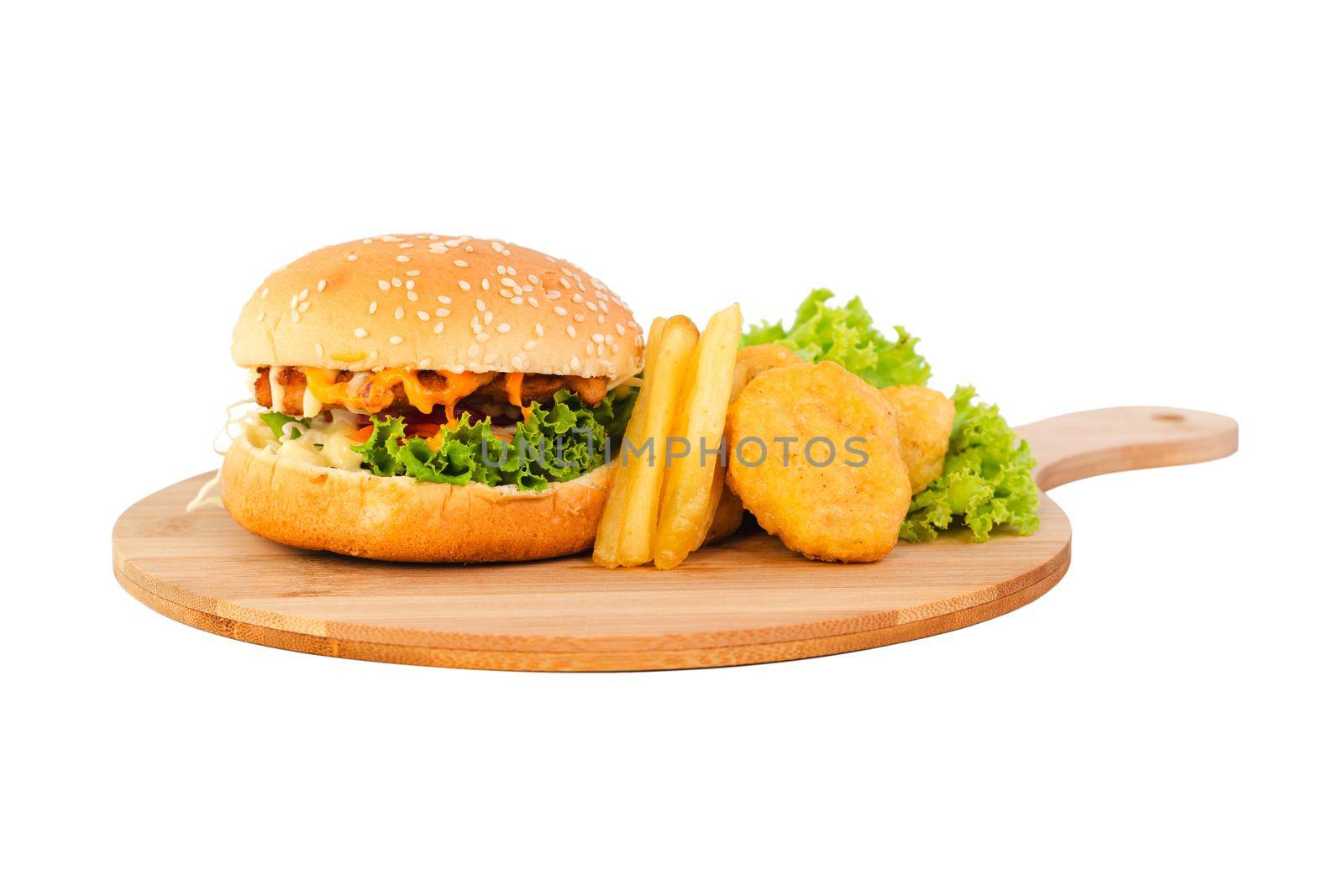 Chicken hamburger with nuggets and french fries on a wooden plate over white background by wattanaphob