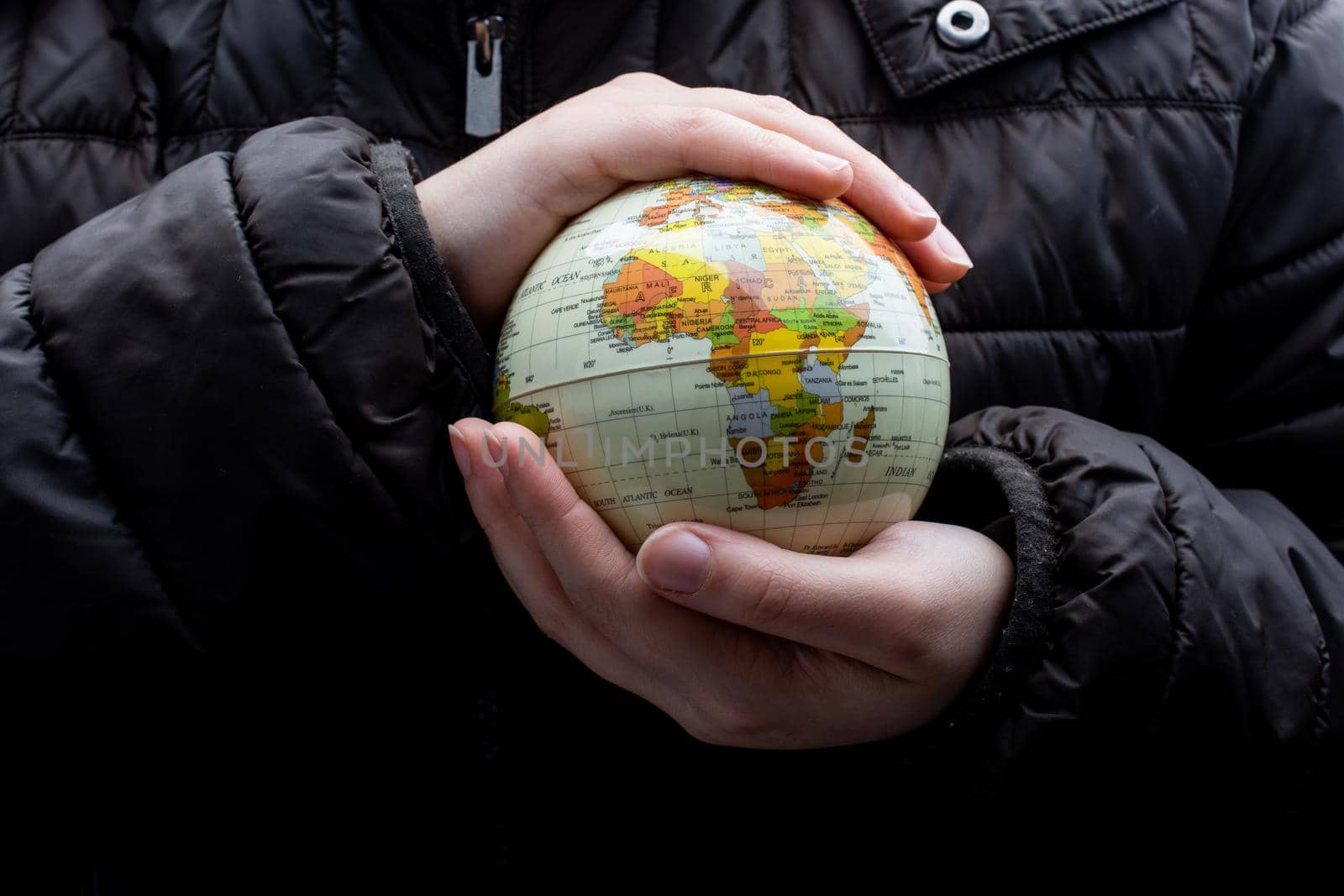 Businessman is standing with an earth globe fot business concept