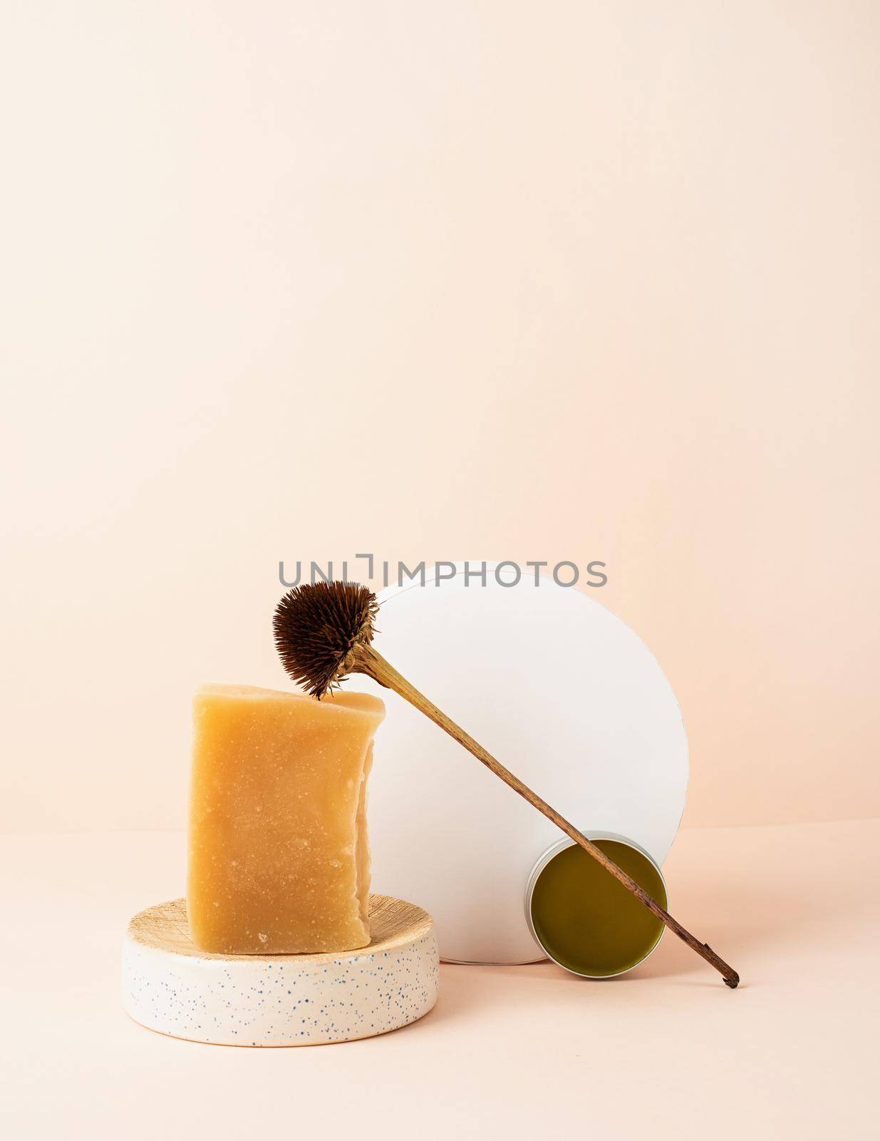 Natural cosmetics.Creative art composition with soap and balsam, natural cosmetics on beige background with copy space