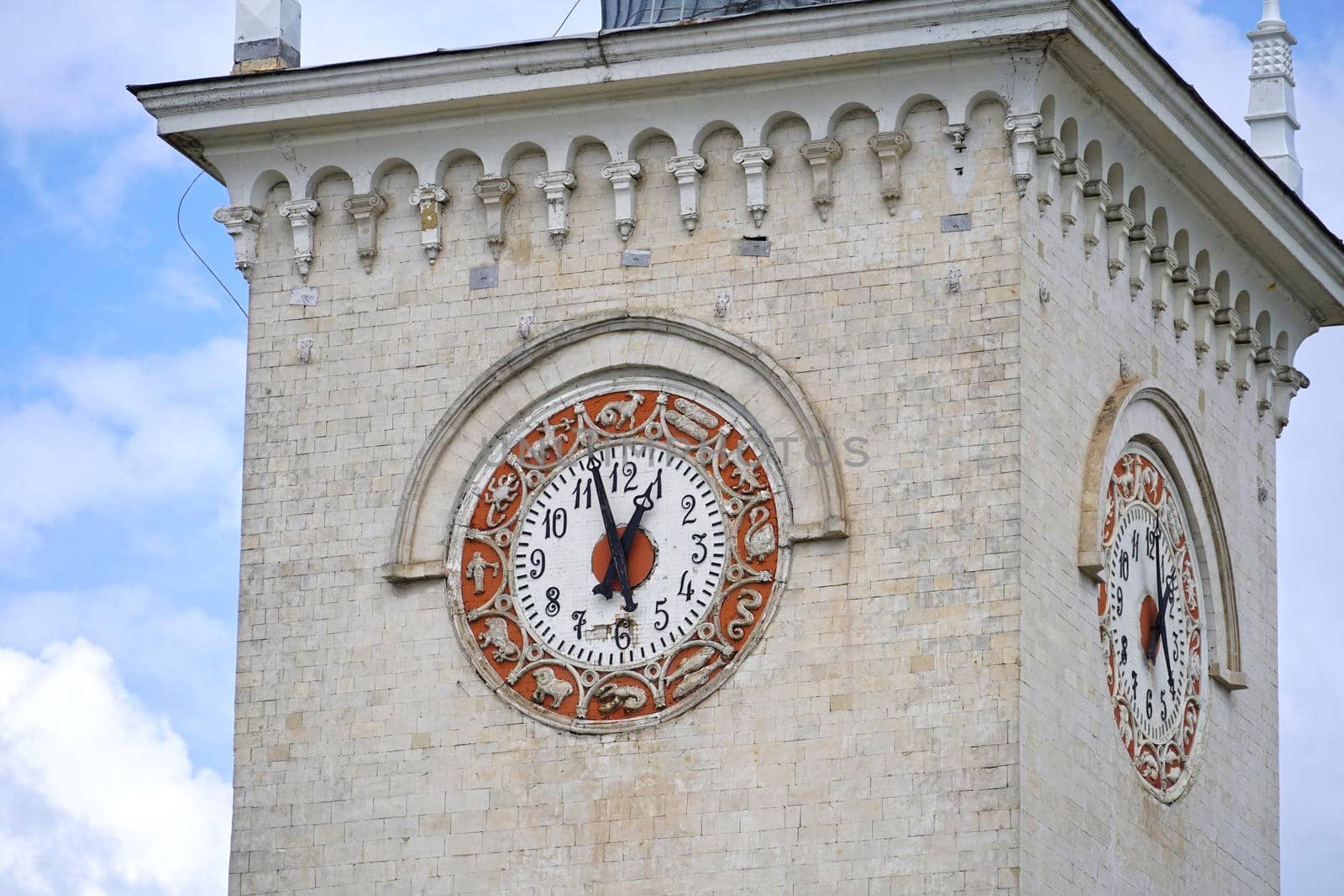 Simferopol, Crimea-June, 6, 2021: The architecture of the railway station with an old clock.