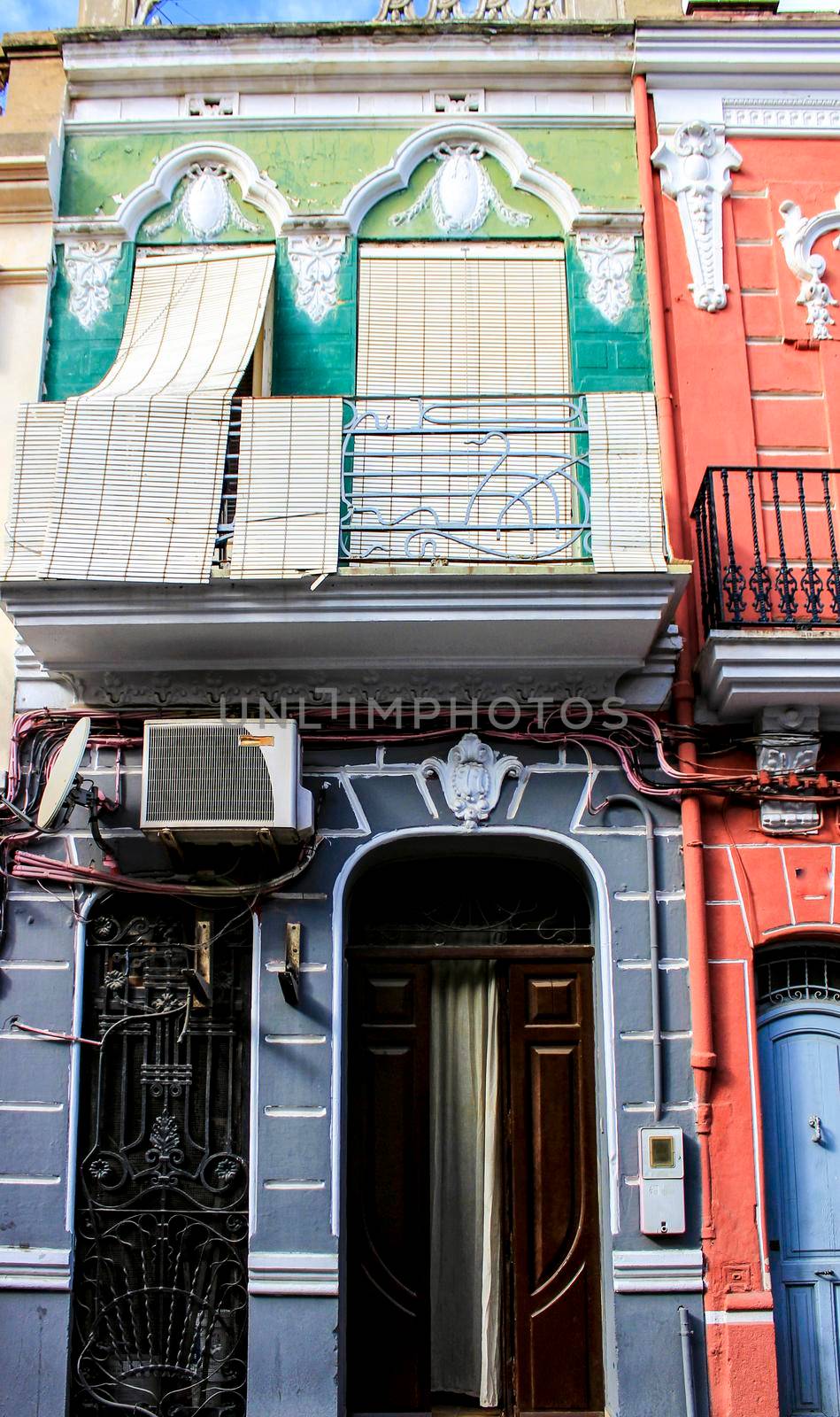 Colorful facades of old buildings in The Cabanyal neighborhood in Valencia, Spain
