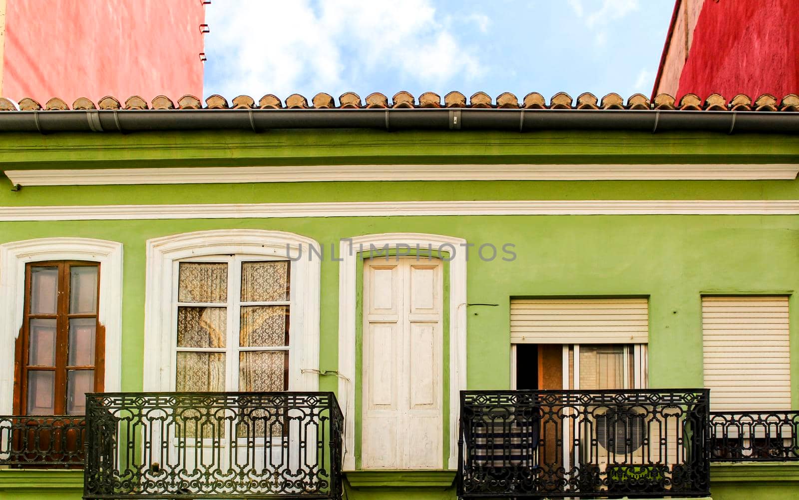 Colorful facades of old buildings in The Cabanyal neighborhood in Valencia, Spain