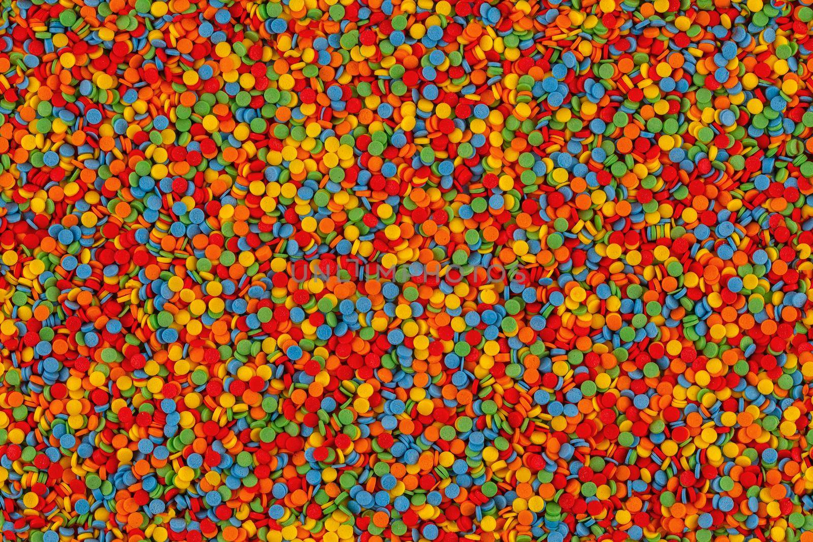 Rainbow sugar sprinkle dots, decoration for cake and seamless bakery texture. Colorful Easter background. Confectionery multicolored decorative topping.