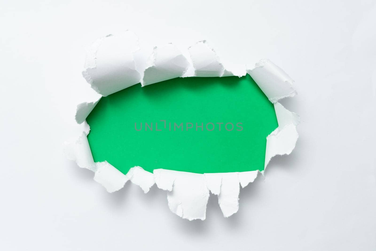 Tear on sheet reveals background behind the front side