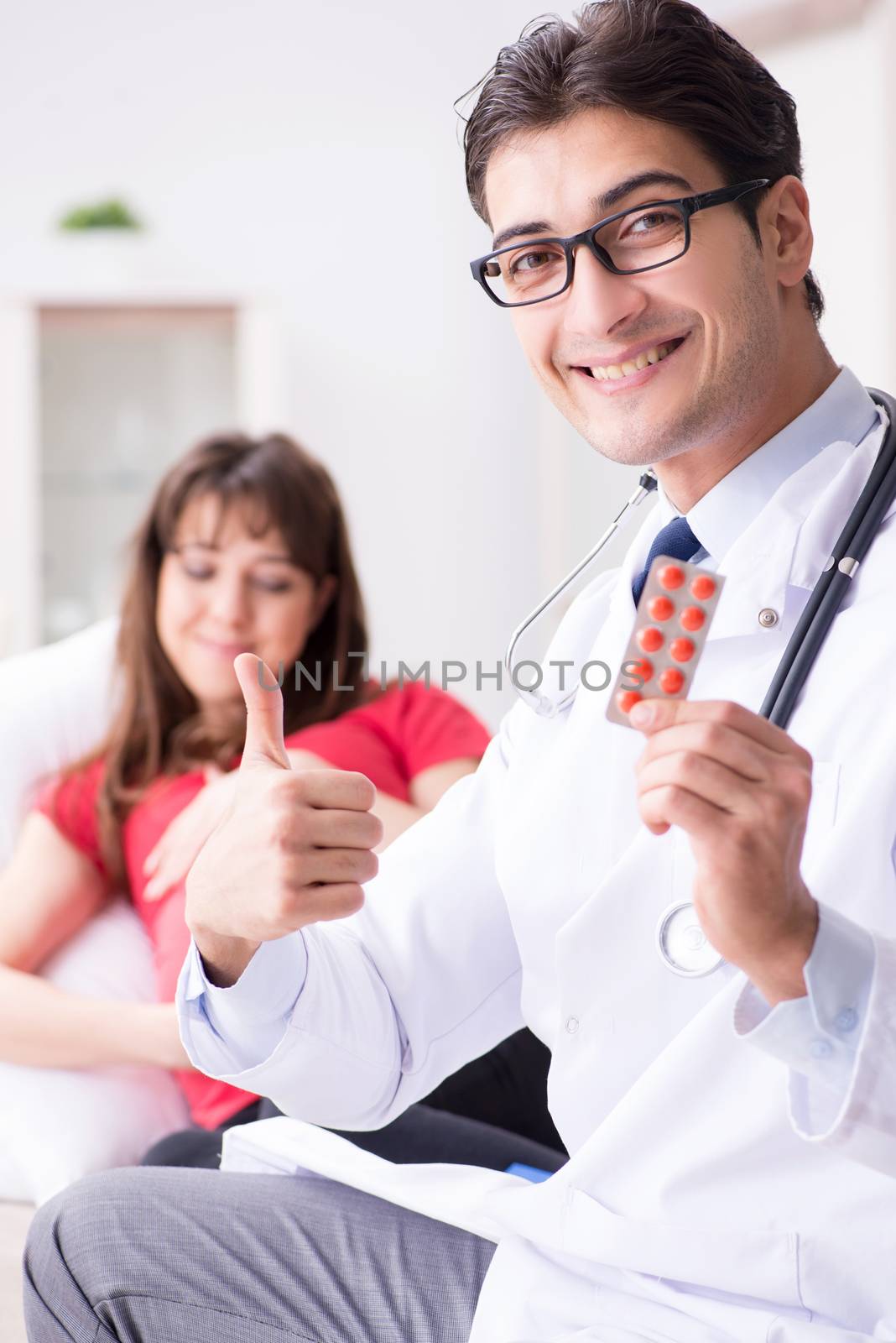Pregnant woman patient visiting doctor for regular check-up