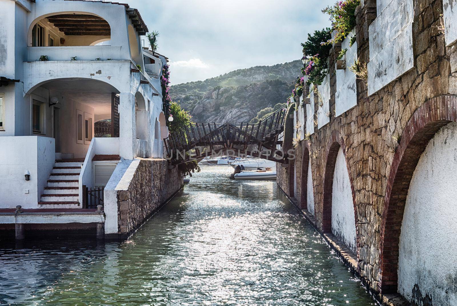 View of the harbor with luxury yachts of Poltu Quatu, Sardinia, Italy. This picturesque town is a real gem in Costa Smeralda and a luxury yacht magnet and billionaires' playground