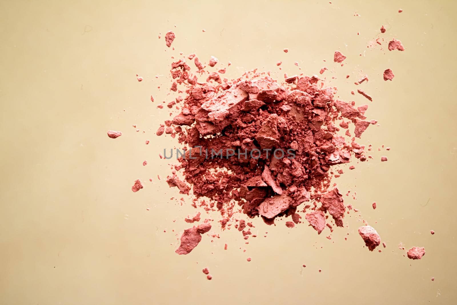 Crushed cosmetics, mineral organic eyeshadow, blush and cosmetic powder isolated on golden background, makeup and beauty banner, flatlay design.