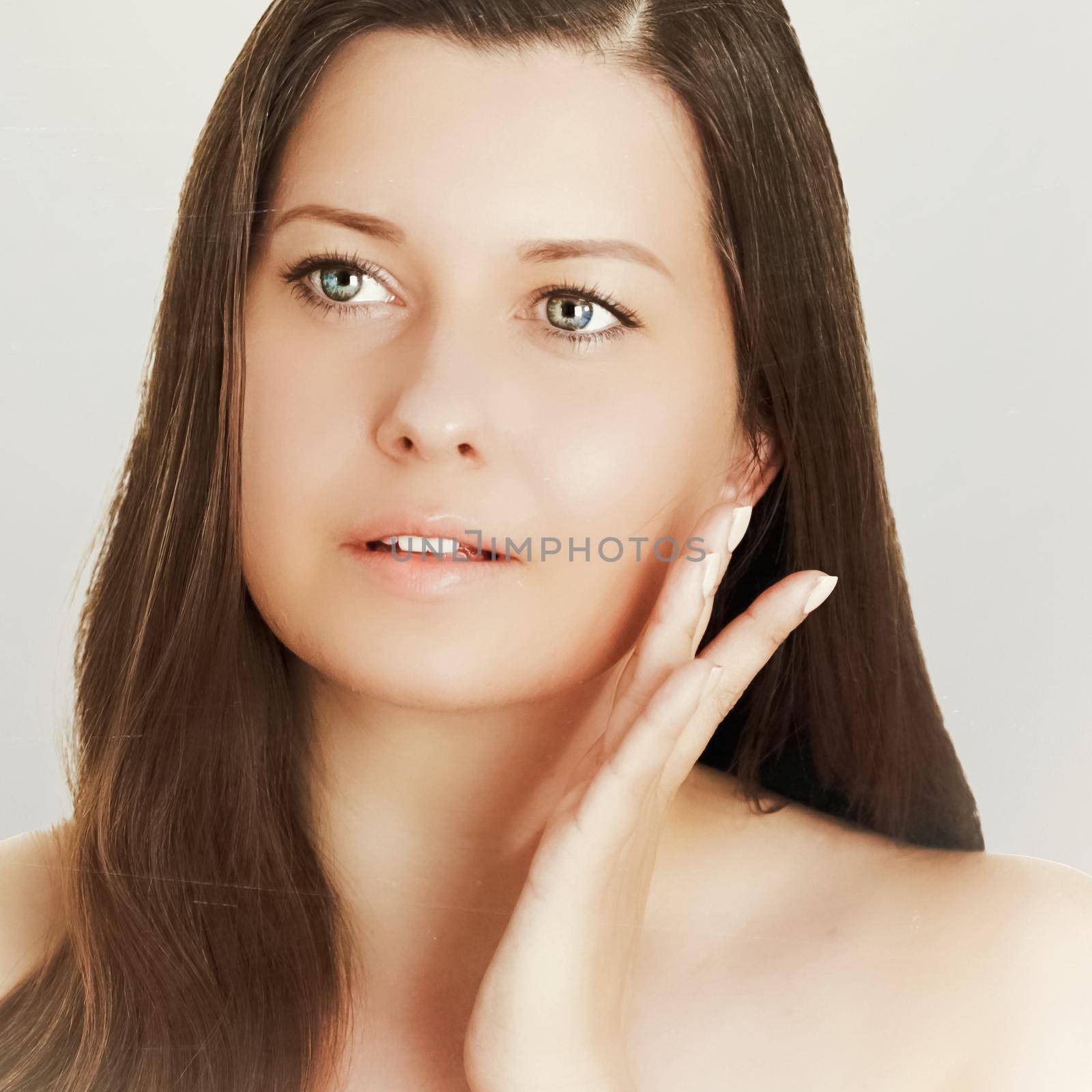 Suntan skin tone and beauty routine. Beautiful brunette female model with natural tan, face portrait of young woman.