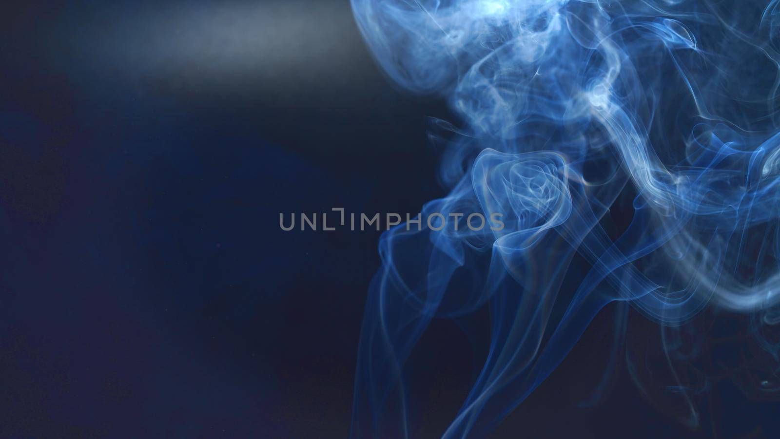 Vintage smoke color movement on black background with copy space. by noppha80