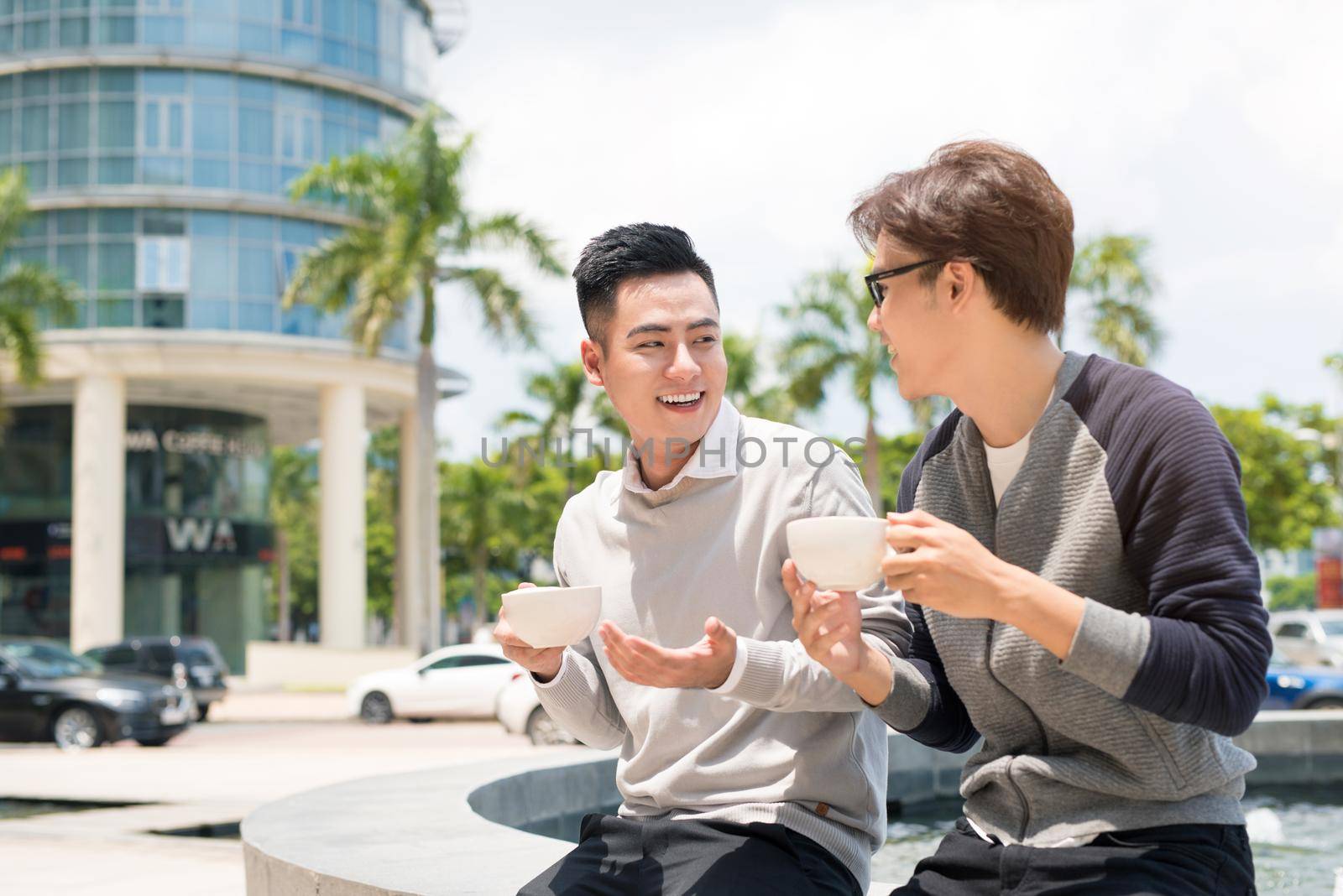 Two businessman having a casual meeting or discussion in the city.