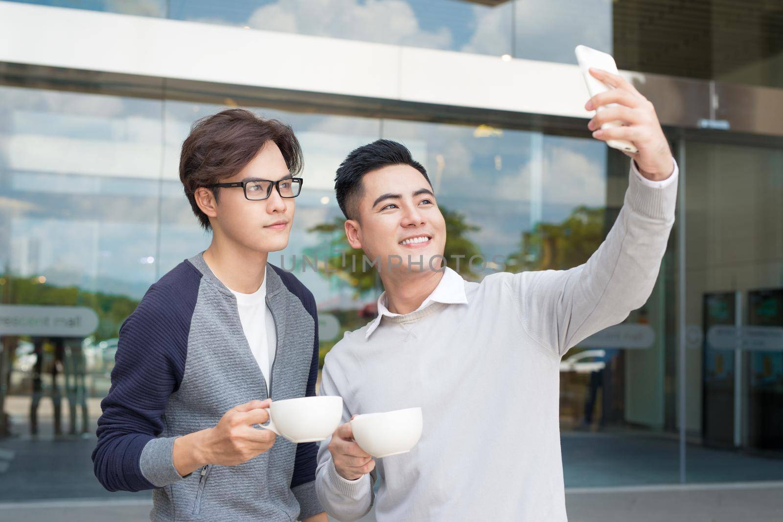 Two young man video call using smartphone