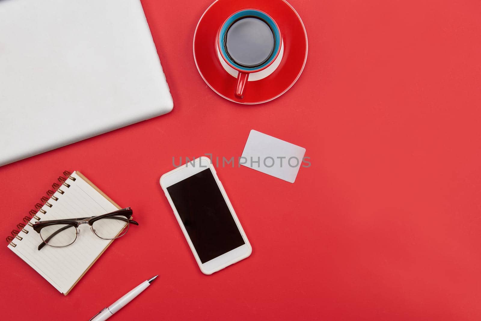 Laptop, cup of coffee, credit card and smart phone .Top view with copy space