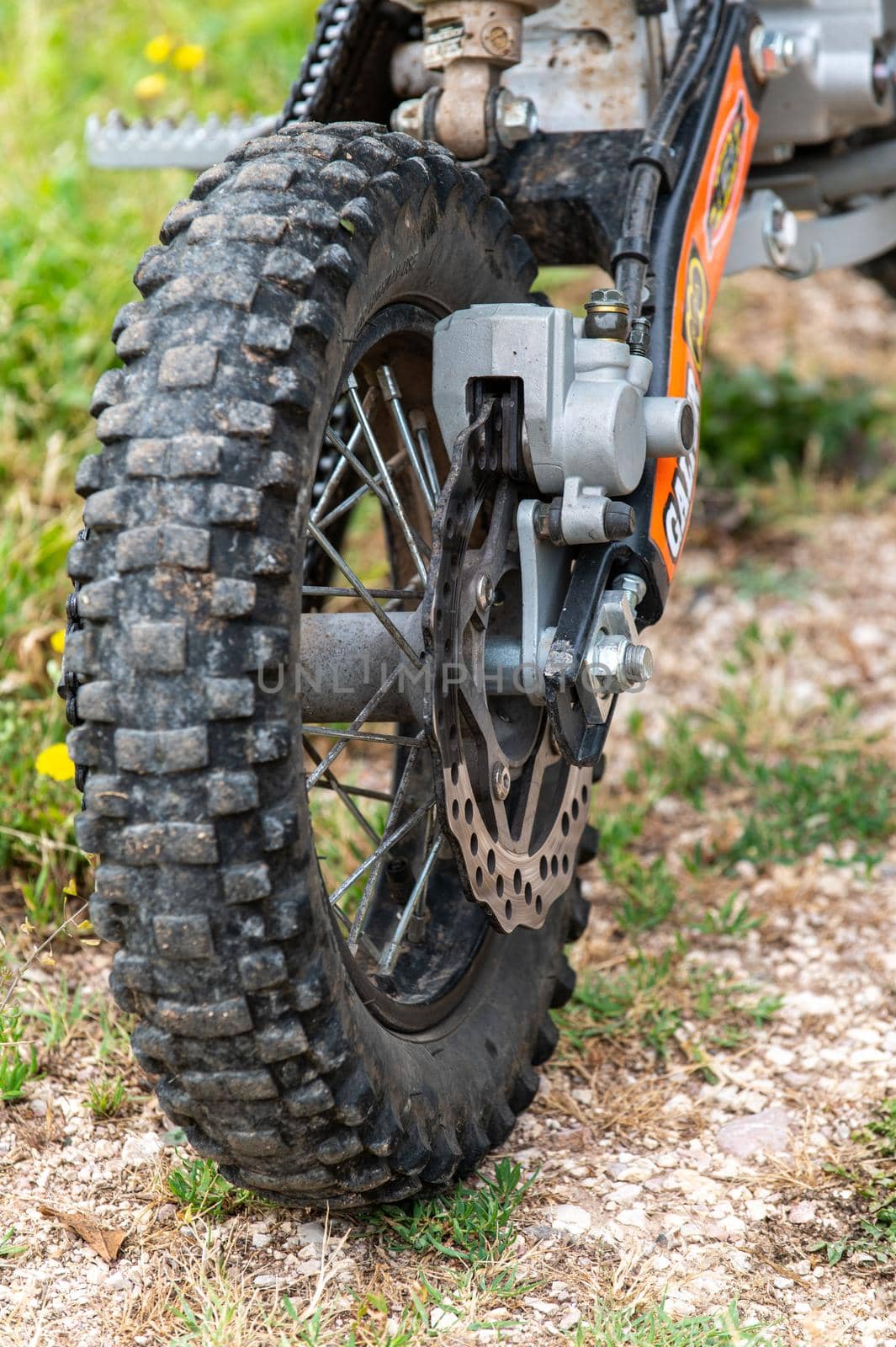 terni,italy june 08 2021:mini motocross detail of the braking part and rear wheel