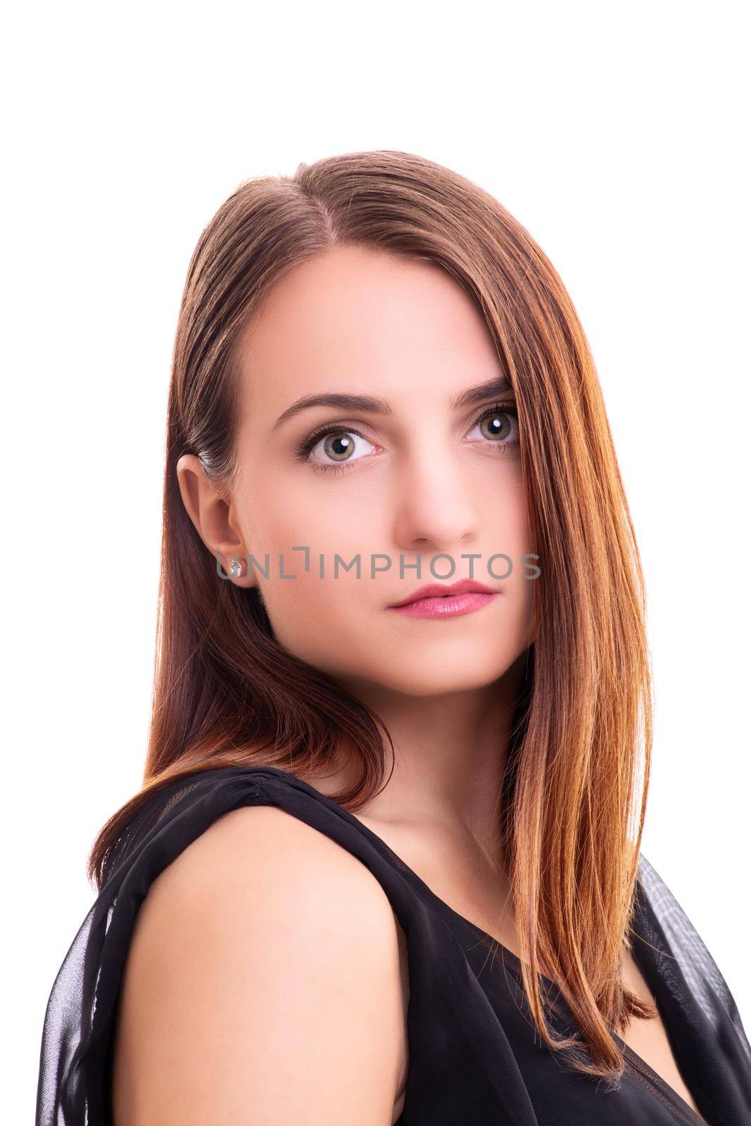 Close up portrait of a beautiful young woman in an elegant black blouse, looking directly at the camera, isolated on white background. Fashion, makeup, model, elegance concept.