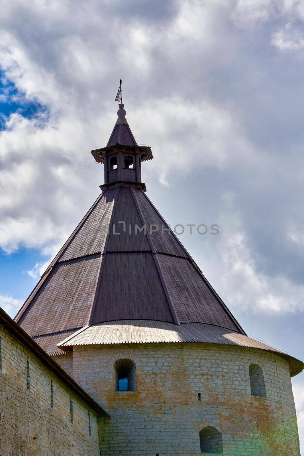 View of the old stone fortress with a watchtower. Fortress Oreshek on a sunny summer day