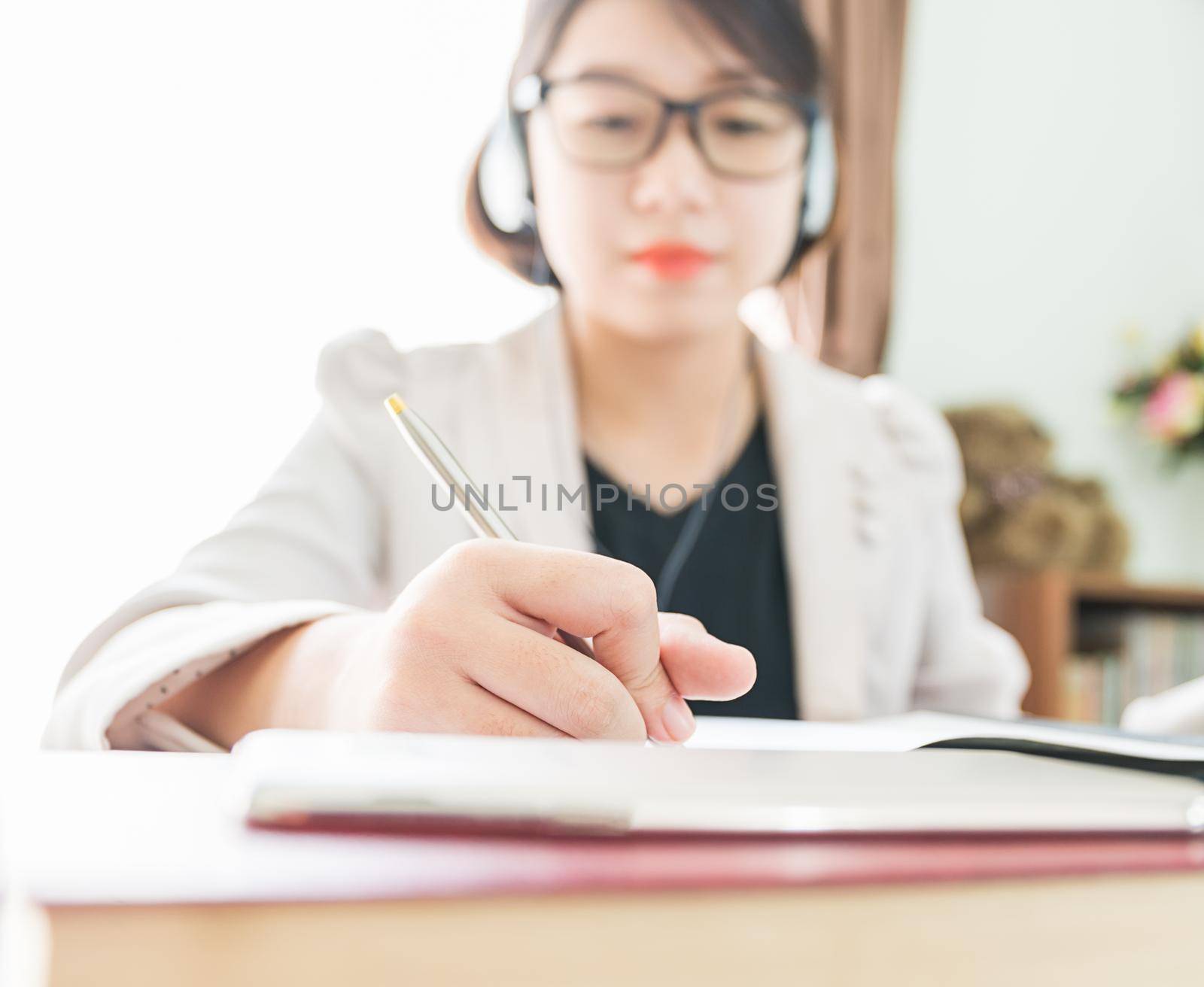 Teenage girl working on laptop in home office by stoonn