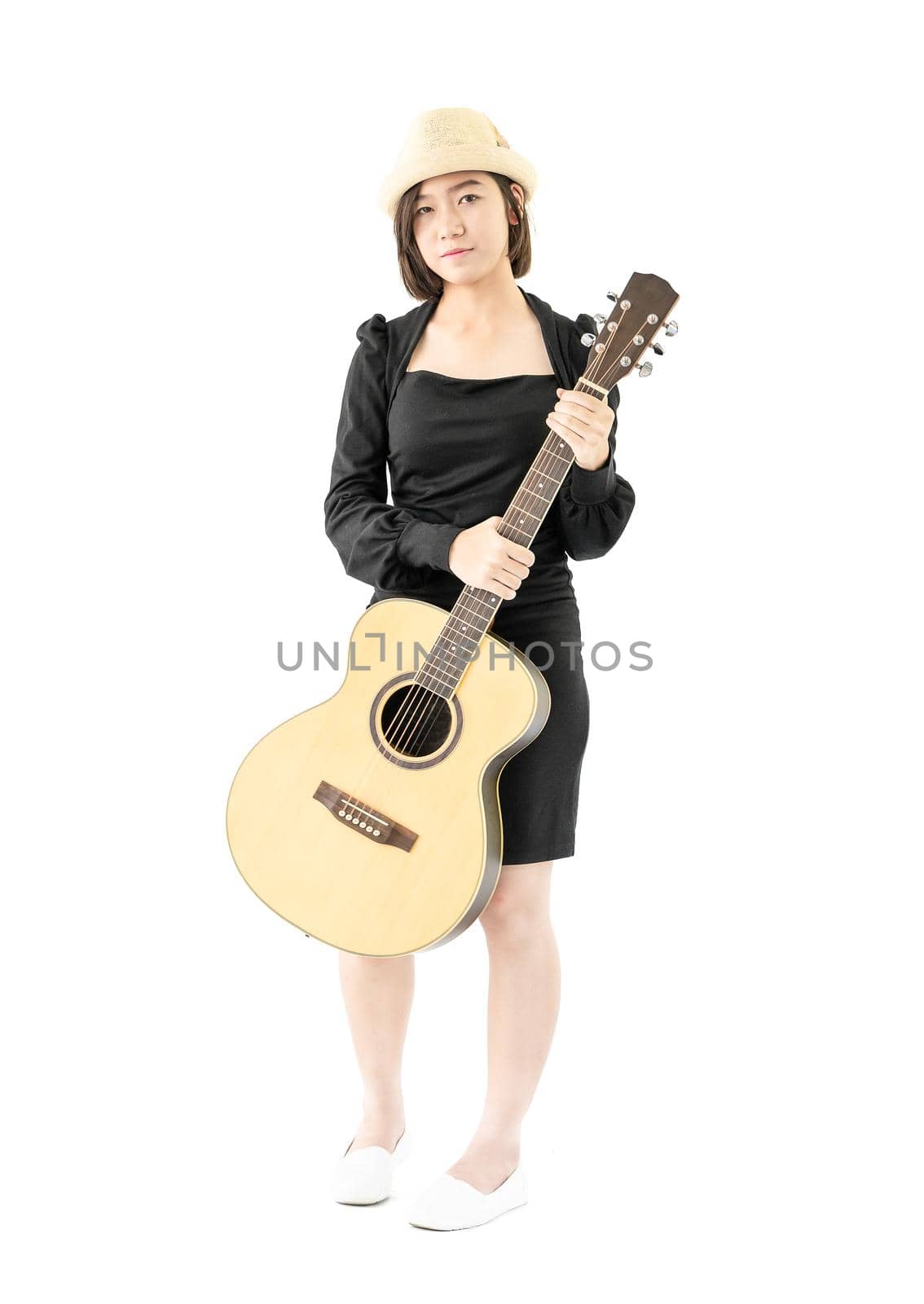 Young asia woman hold guitar guitar folk song in her hand isolate on white background