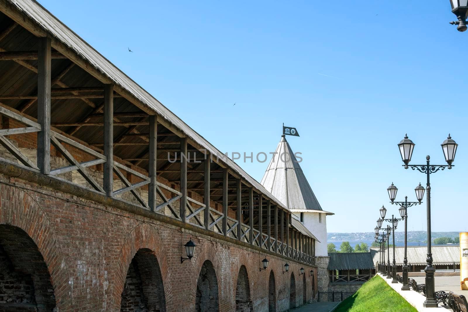 Kazan, Russia - May 19, 2021. A perspective fragment of the fortress defensive wall of the ancient Kazan Kremlin. Historical heritage. Selective focus.