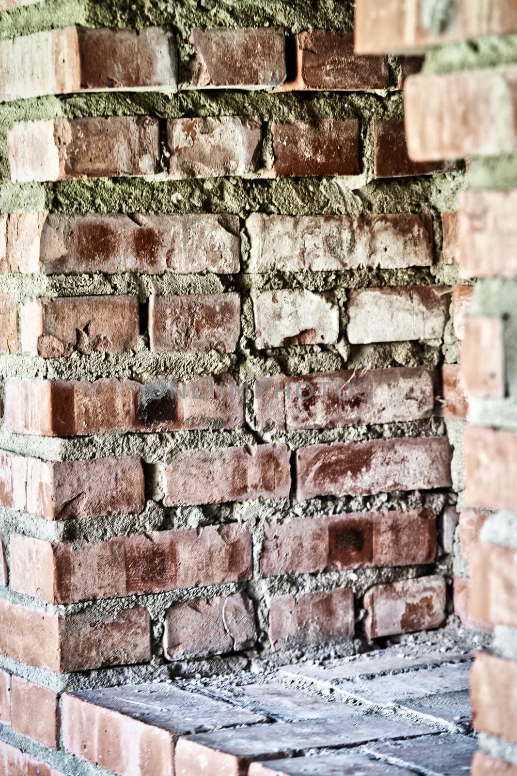 Observation window in the brick wall of the fortress for firing a gun with a view of the river water and the forest