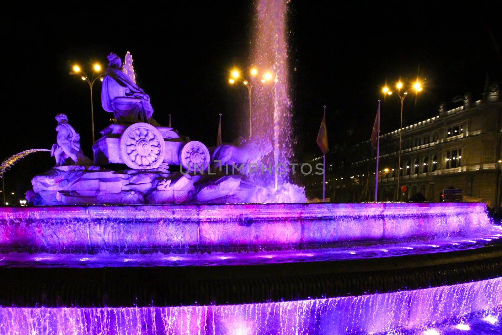 Beautiful Cibeles fountain illuminated in purple in the International Women's Day