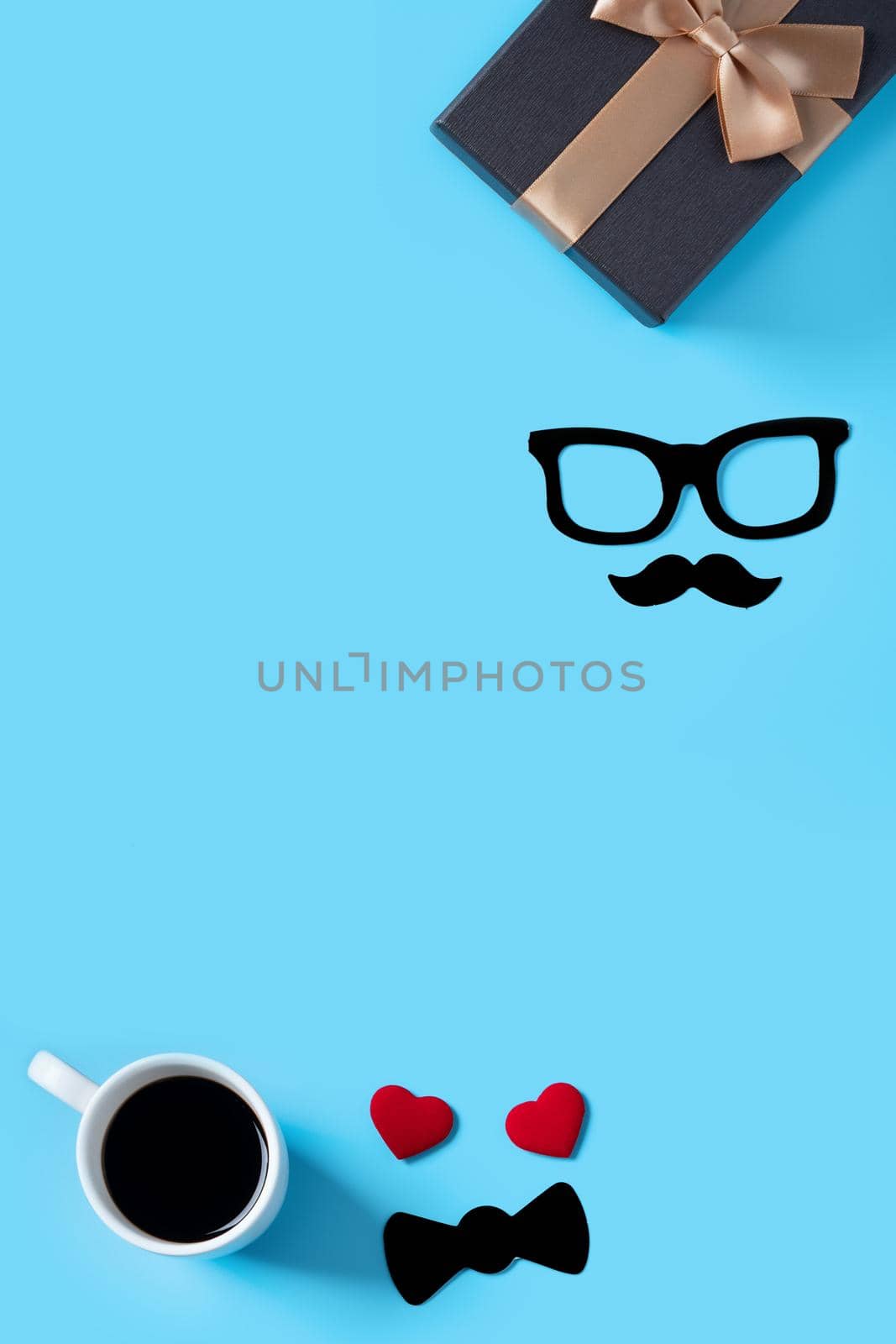 Father's day background design concept. Top view of color paper decoration layout ideas with gift box on blue table background with copy space.