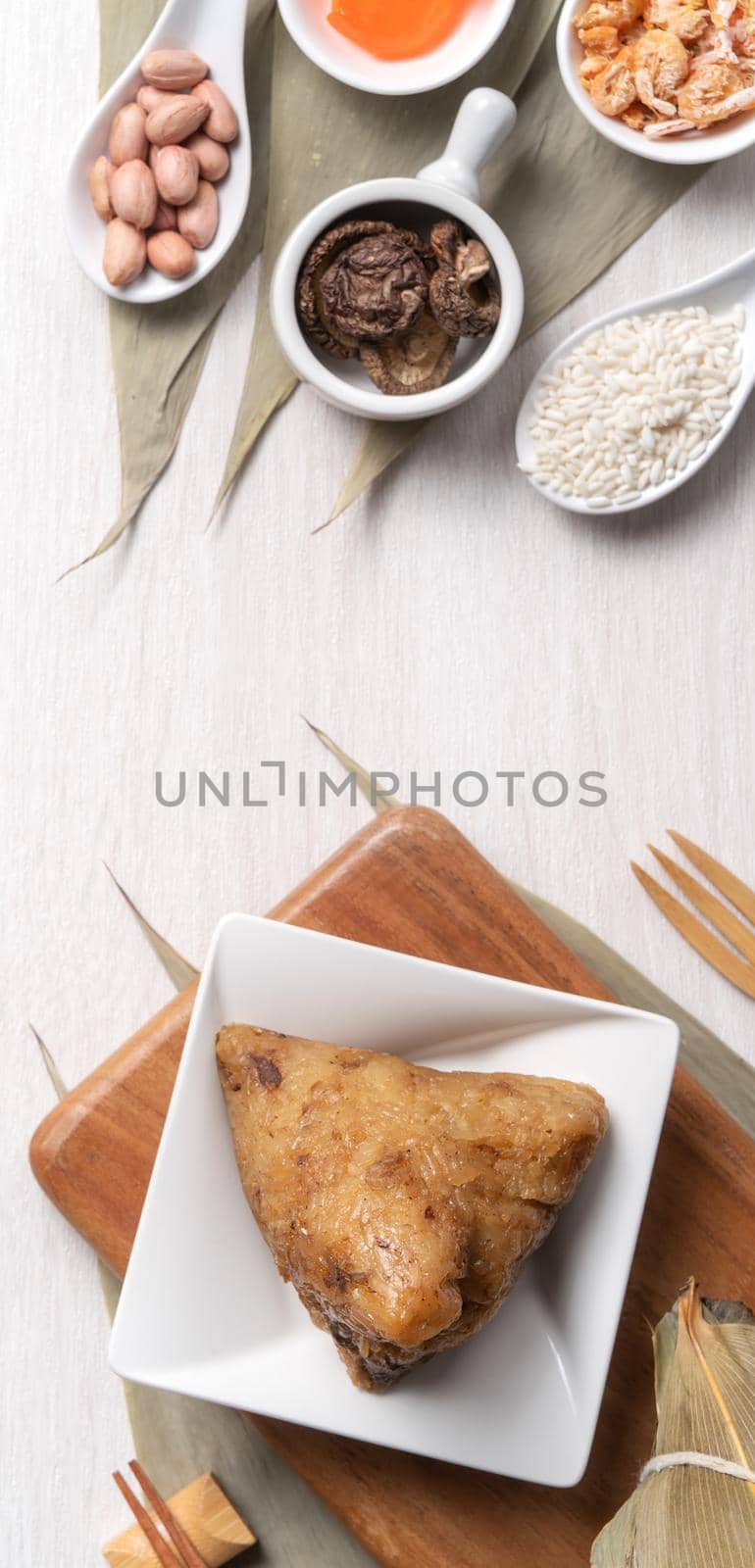 Zongzi. Delicious traditional rice dumpling food for Dragon Boat Duanwu Festival over wooden table background top view.